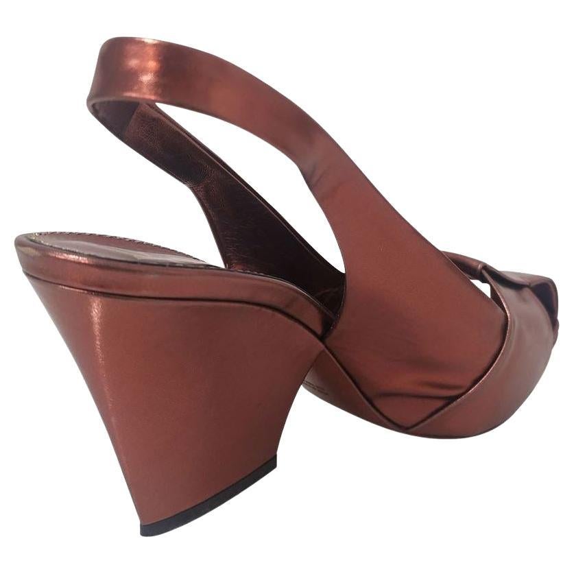 Laminated calfskin Rust color Heel high cm 10 (393 inches) Plateau height cm 15 (059 inches) With box and dustbag
