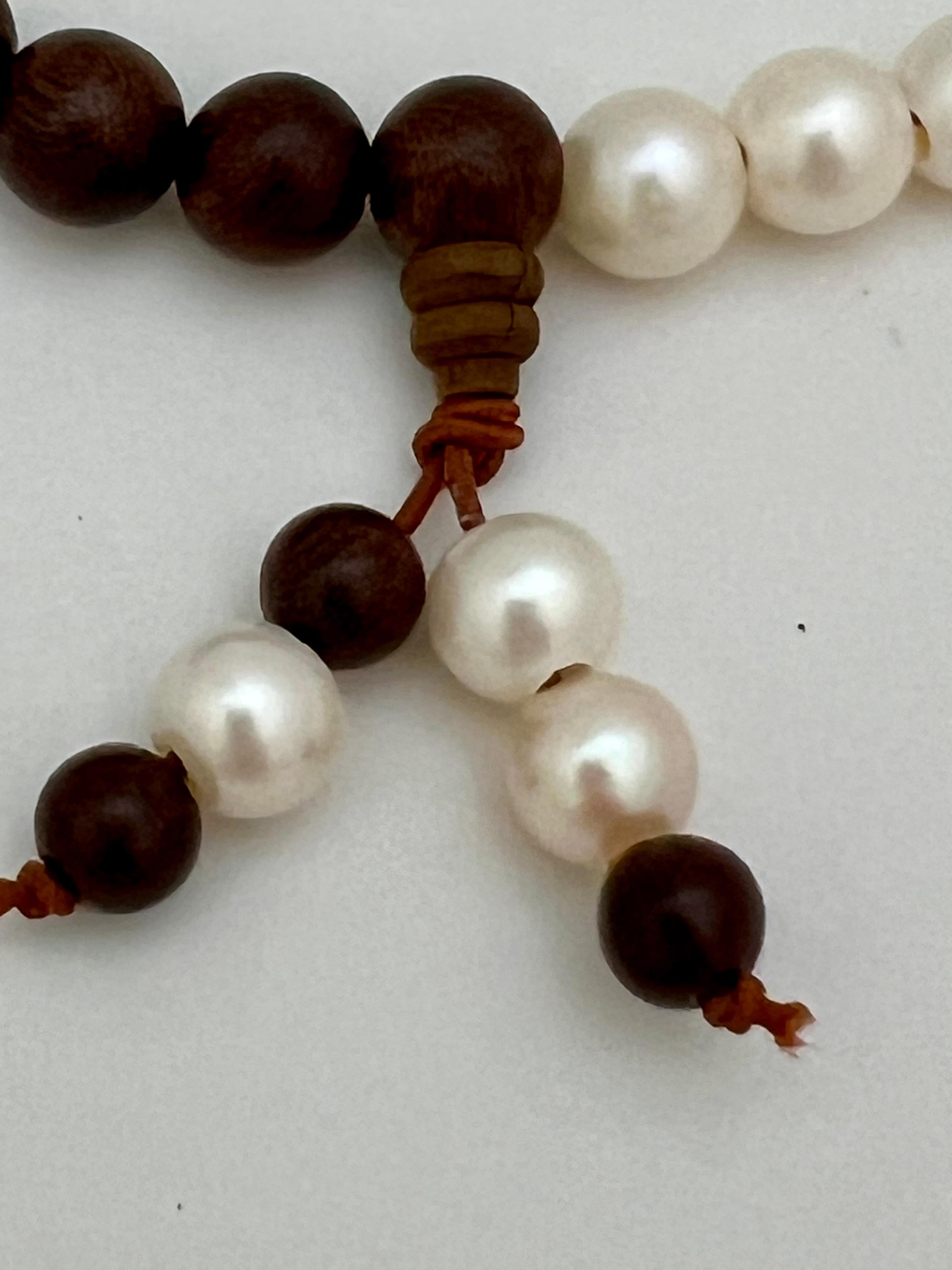 🌸 Grace Meets Mindfulness – Sandalwood & Freshwater Pearl Buddhist-Inspired Necklace/Bracelet 📿

Elevate your style and spirit with this beautifully handcrafted Buddhist-inspired necklace, a graceful fusion of tradition and modern elegance. Made