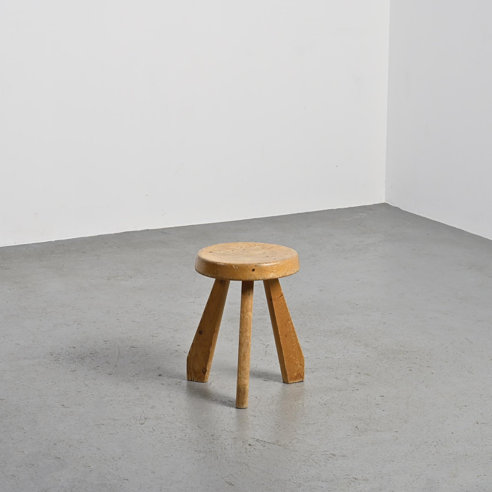 
A rare find, the pine Sandoz stool, a creation of Charlotte Perriand  boasting a thick round seat and distinctive tripod legs. 

Originally crafted around 1955 by Charlotte Perriand, it found its place in Perriand's personal chalet in Meribel.