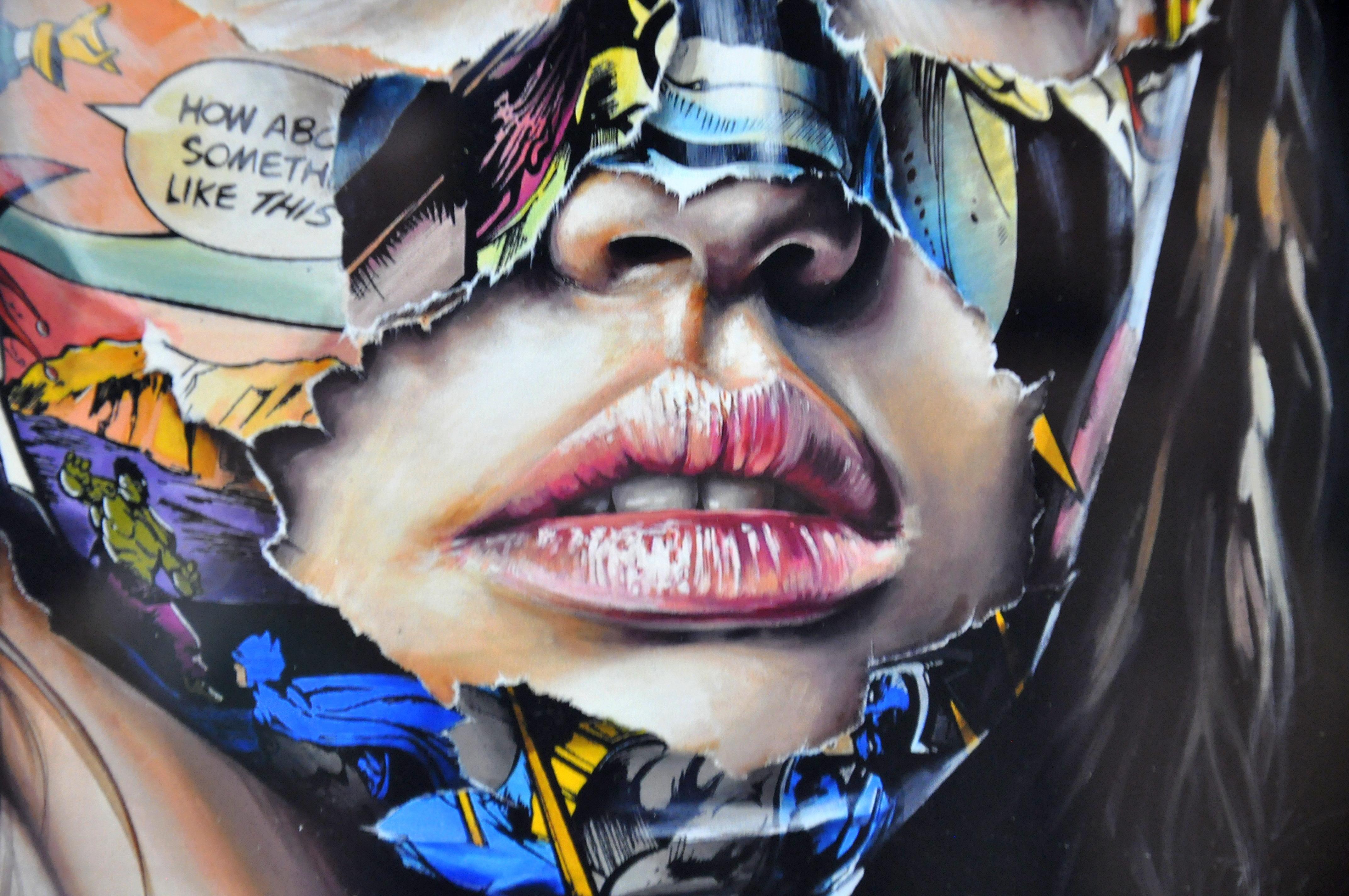Limited edition art print by Canadian artist Sandra Chevrier, from an edition of 100. Professionally framed in a white shadowbox frame; unframed size 9 in x 11 in.; depicting a woman's portrait with comic book collage on a black background.
Sandra