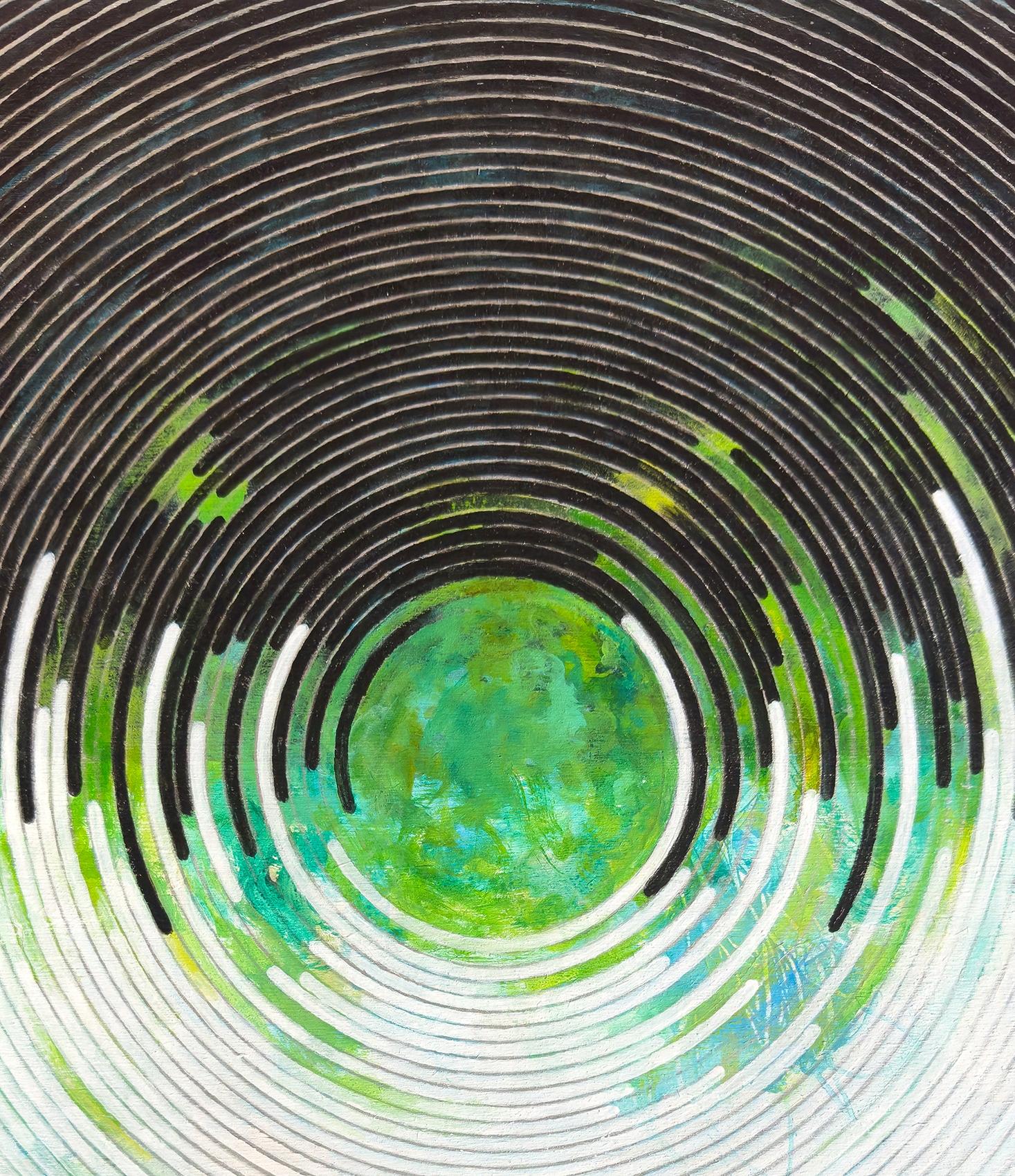 Sandra Cohen’s “Tilt” is a 14 x 14 x 1 inch abstract geometric painting on cradled wood, in bright blue, green, black, white, and silver. At the center is an Earth-like circle filled with vibrant blue and vertiginous green. The background of flat