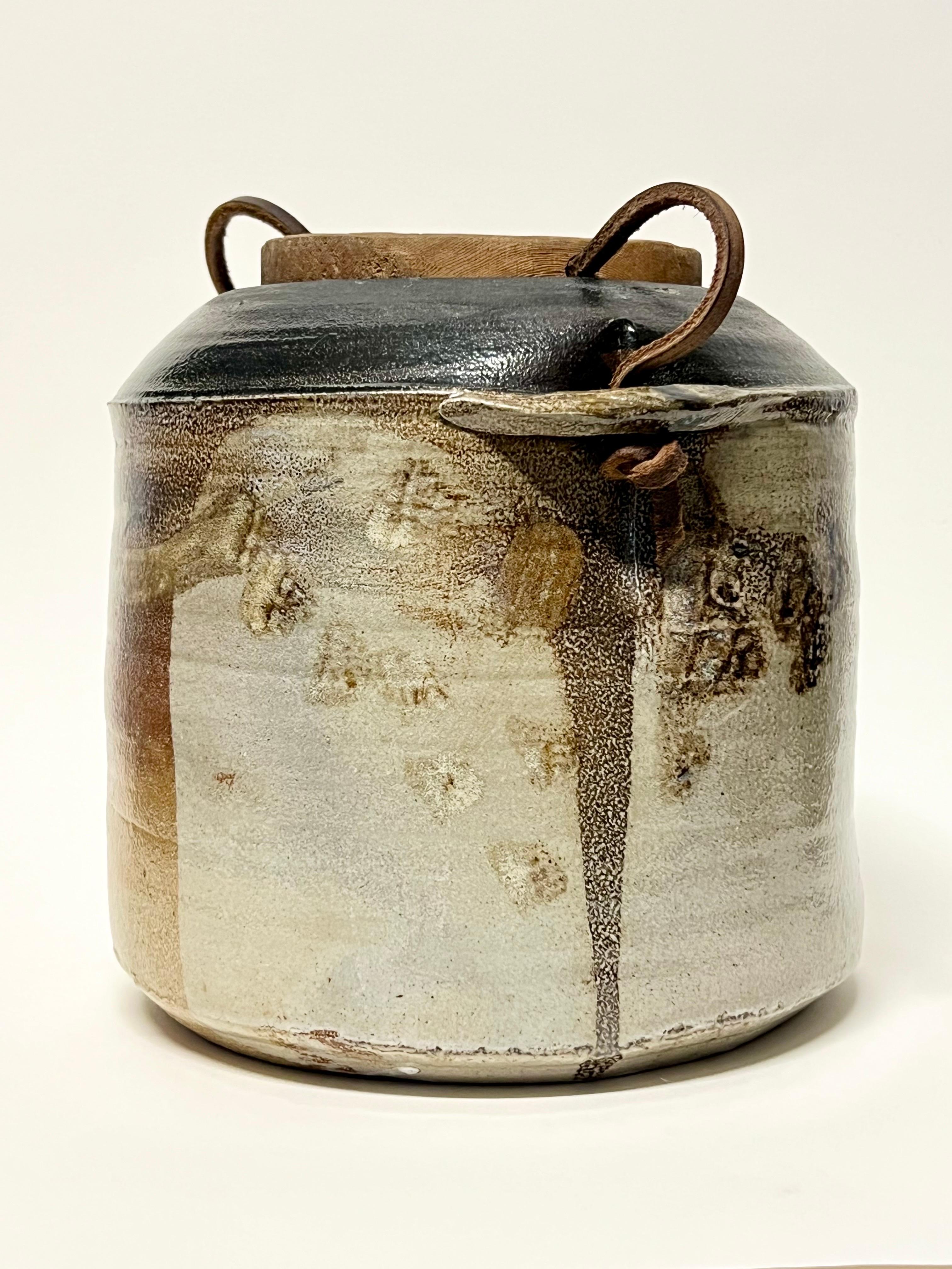 Amazing salt-fired lidded vessel by well listed potter, Sandra Johnstone c1970s. Johnstone (1936-1991) studied with Peter Voulkos at UC Berkeley in the 1950s. In addition Johnstone also studied with Paul Soldner. She eventually went on to build her