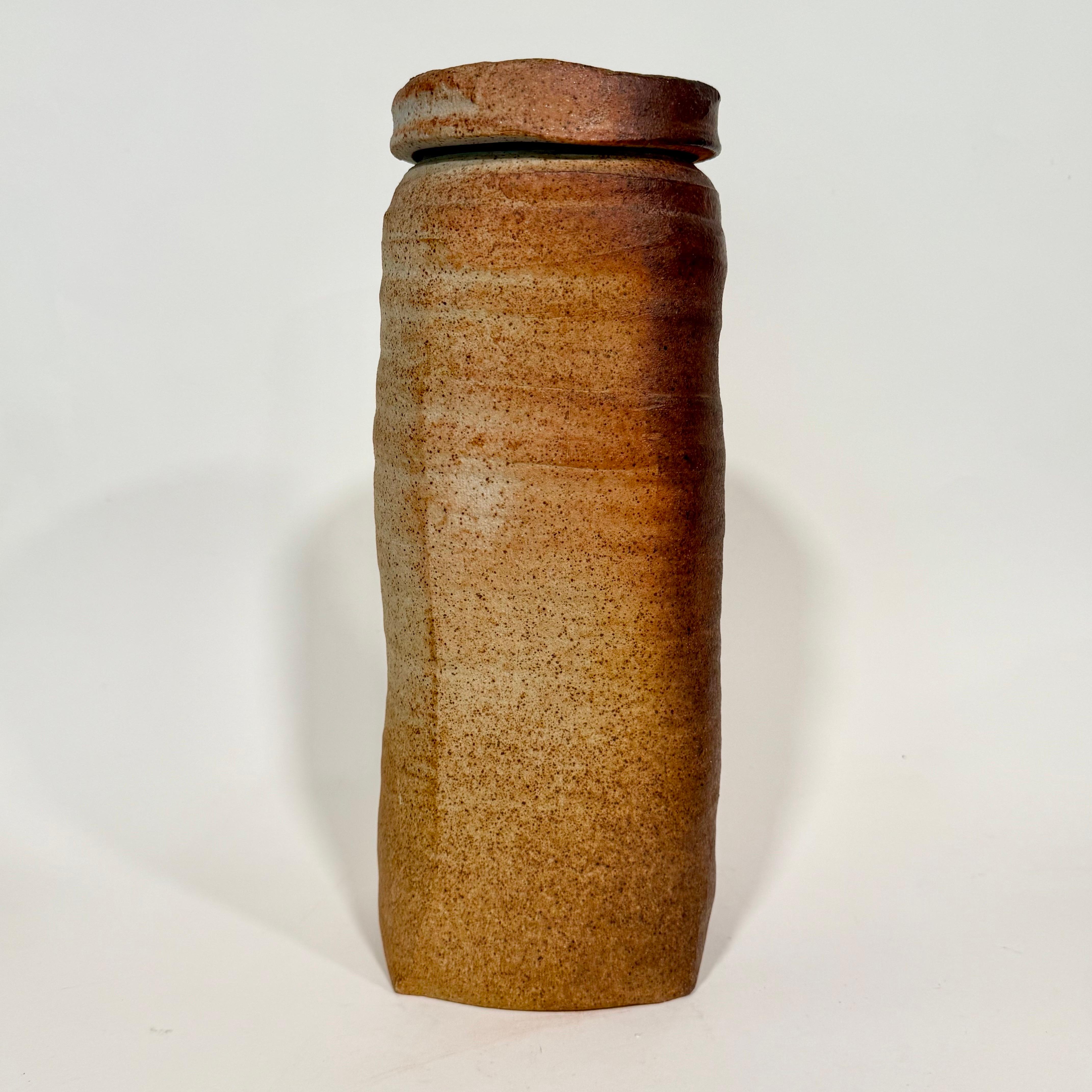Amazing early wood-fired lidded vessel by well listed potter, Sandra Johnstone c1970s. Johnstone (1936-1991) studied with Peter Voulkos at UC Berkeley in the early 1950s. She was at the forefront of a very pivotal time in ceramics where things