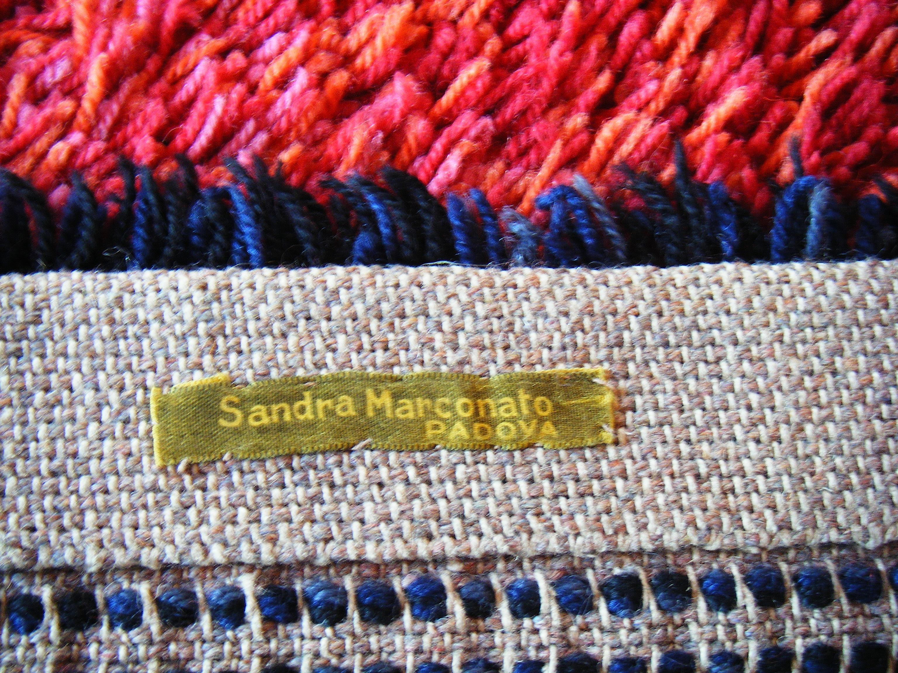 Carpet made by the Italian artist Sandra Marconato (with her authentication) woven entirely by hand.
It was created in 1970 and at that time it was exhibited at the Adelphi gallery in Padova during one of her exhibitions. 
Sandra Marconato