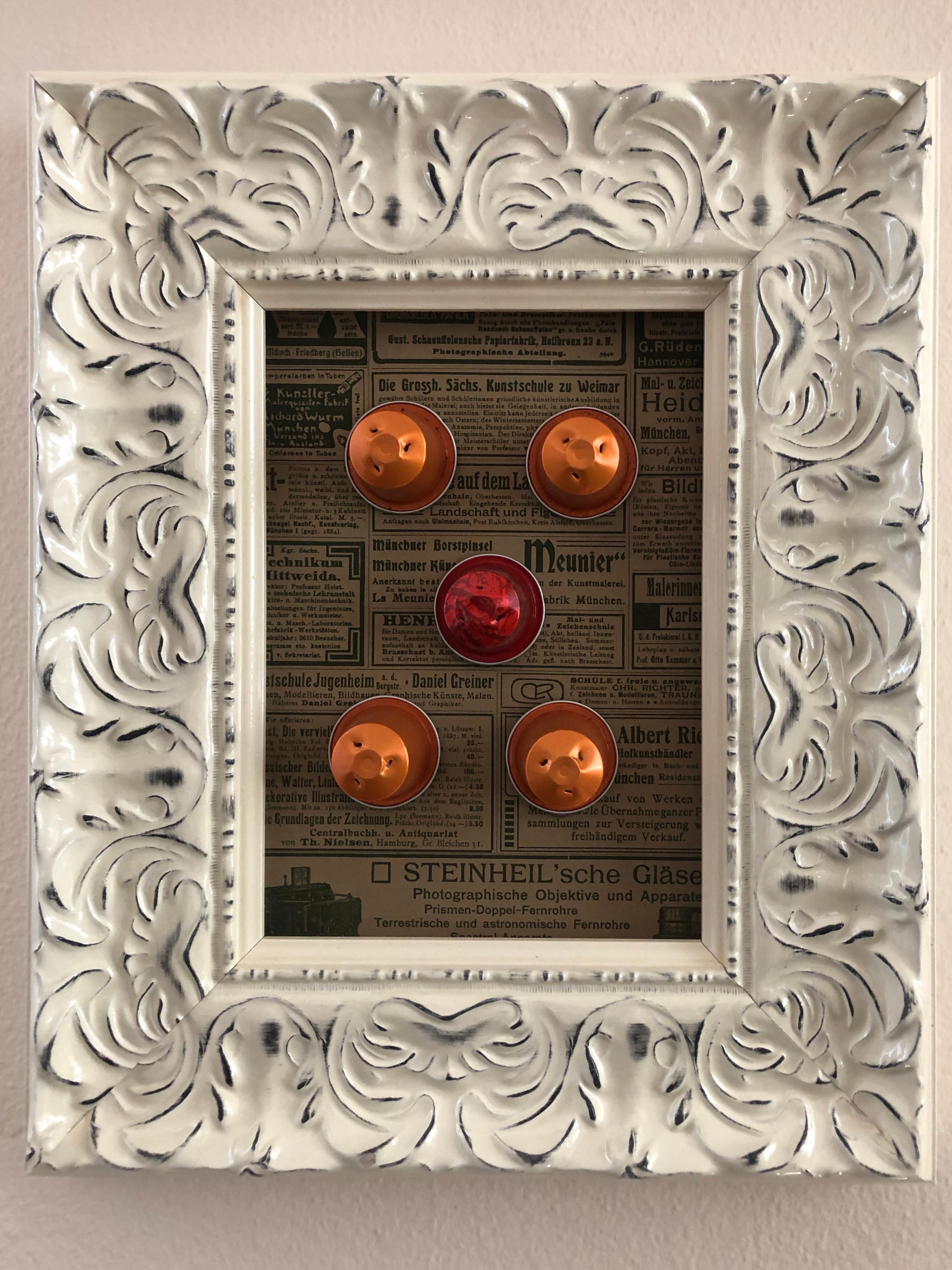 The picture belongs to the cycle RECYCLED, done during the pandemic Covid. The material is a heavy wooden frame, used Nespresso capsules and 19th Century newspaper sheet. Will be signed on the back by the author.