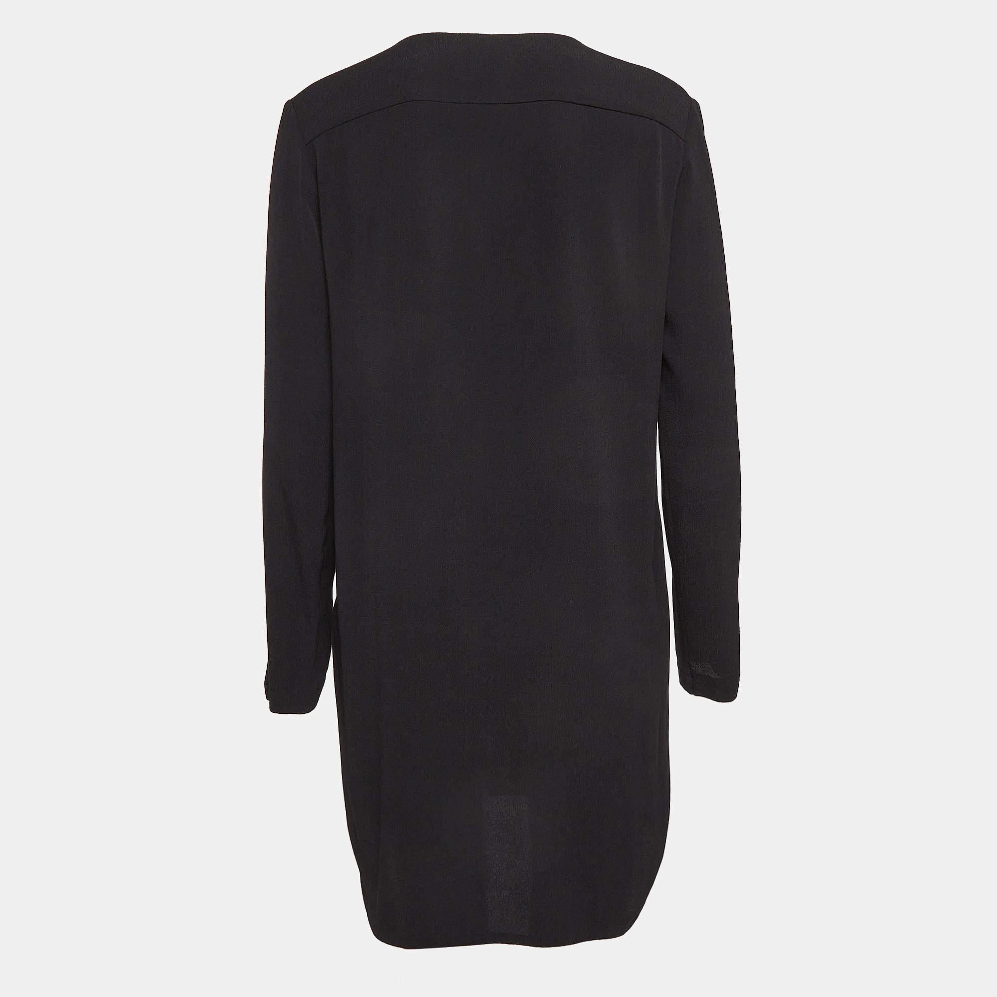 This Sandro dress brings elegant details and a chic silhouette. Featuring long sleeves and front tie detail this dress is a winner with flats as well as heels. It is bound to give you comfort.