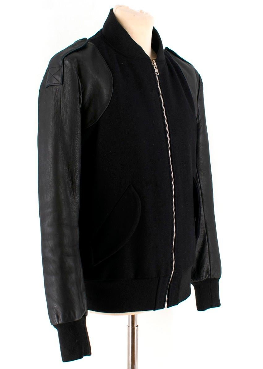 Sandro Black Leather Sleeved Bomber Jacket.

- Really soft 100% Cow leather long sleeves
- Concealed popper front pockets
- Two interior pockets
- Exposed centre front zip fastening
- Ribbed edging on the collar, cuffs and hem
- Soft & smooth satin