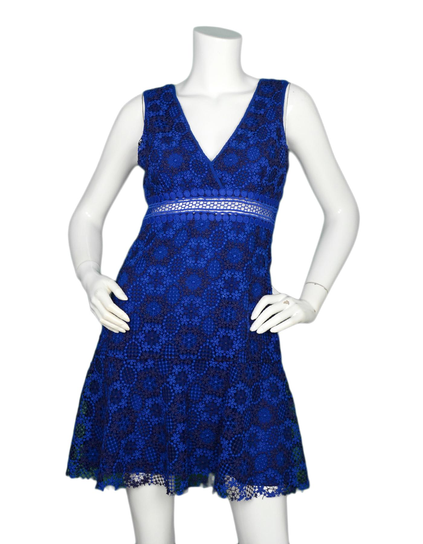 Sandro Blue Embroidery Lace V-Neck Sleeveless Dress Sz 6

Made In: Tunisia
Color: Blue
Materials: 100% polyester
Lining: 100% polyester
Opening/Closure: Hidden side zipper with hook eye at top
Overall Condition: Very good pre-owned condition with