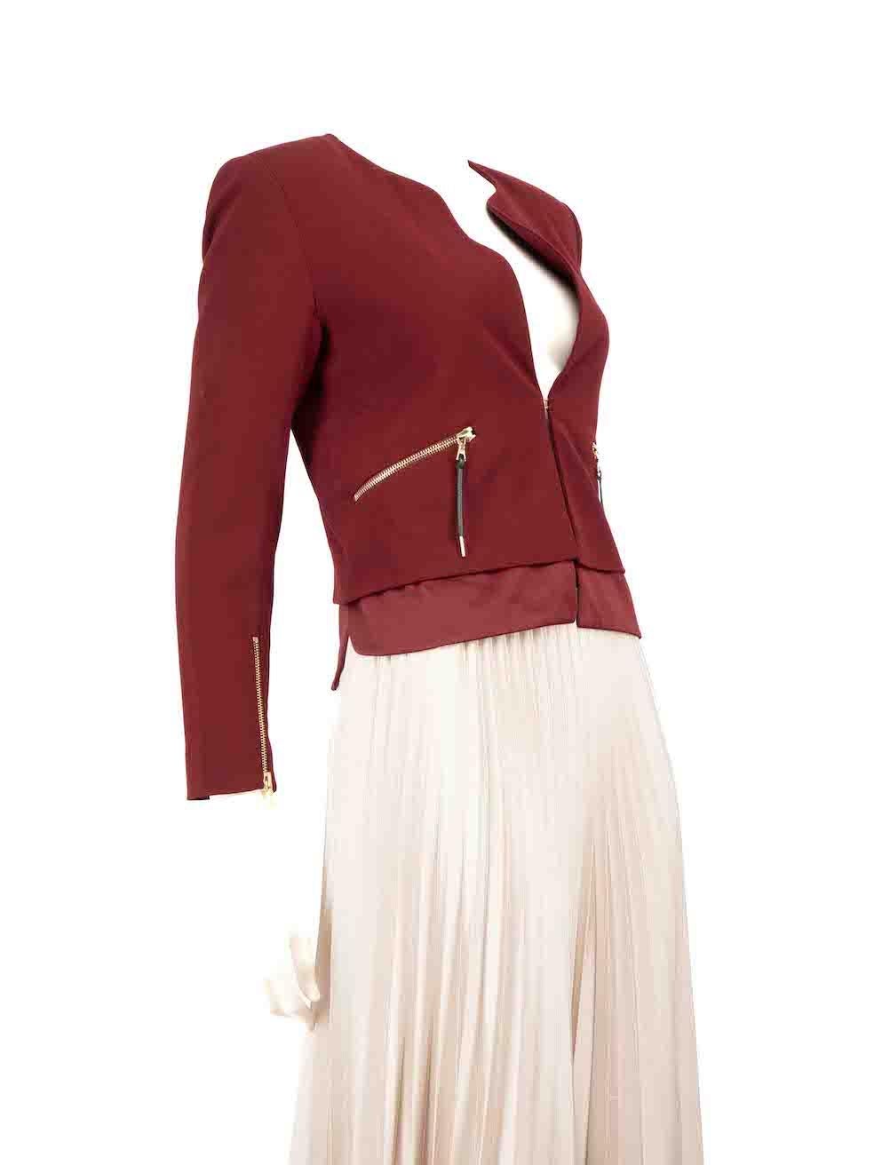 CONDITION is Very good. Minimal wear to the jacket is evident. Minimal wear to the front is seen with a pen mark above the pocket and a pull in the left shoulder's weave on this used Sandro designer resale item.
 
 
 
 Details
 
 
 Burgundy
 
