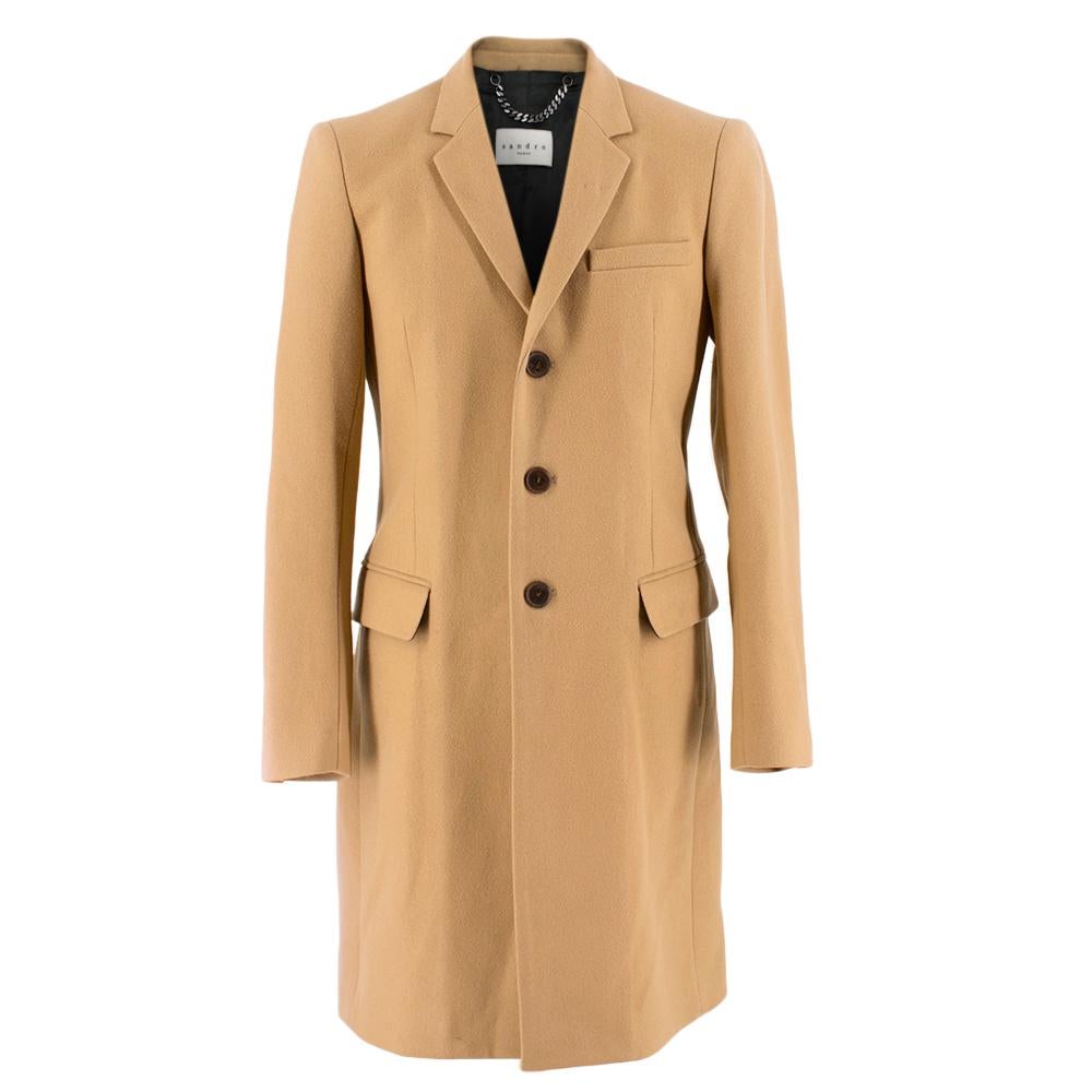 Sandro Camel Colored Long Coat

- Sinched at waist
- Two vents in back
- Full satin lining inside
- Three buttons in front
- Light padding in shoulders

Please note, these items are pre-owned and may show signs of being stored even when unworn and