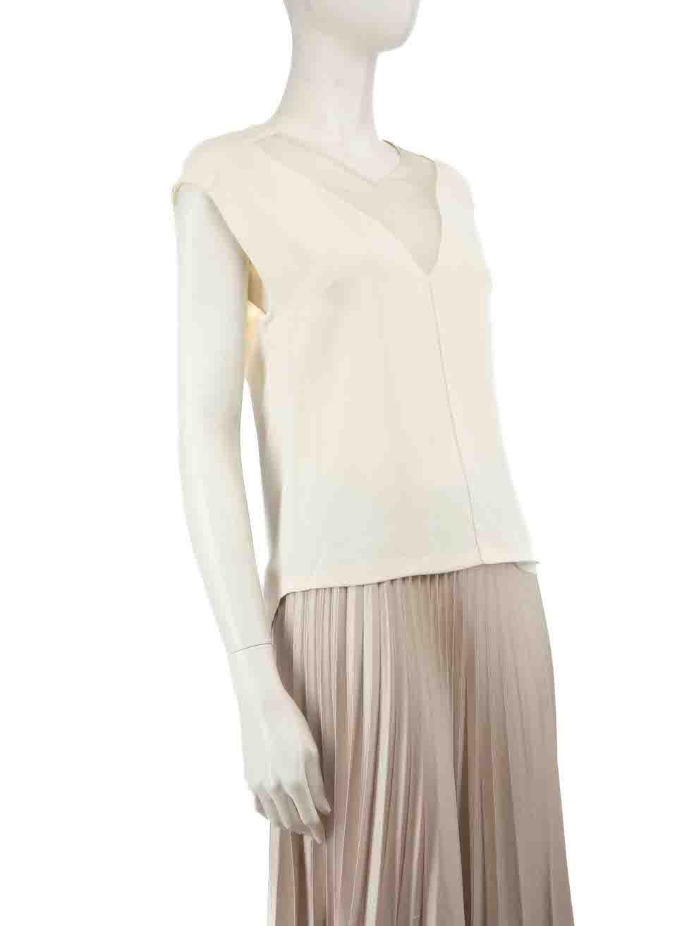 CONDITION is Good. Visible wear to top is evident. There are plucks to the weave at the shoulders and some discolouration around neckline on this used Sandro designer item.
 
 Details
 Cream
 Viscose
 Top
 Sleeveless
 Sheer neck panels
 V-neck
 
 
