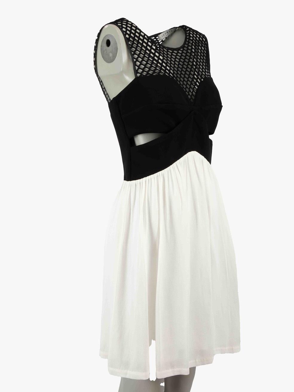 CONDITION is Very good. Hardly any visible wear to dress is evident on this used Sandro designer resale item.
 
 Details
 Black and white
 Viscose
 Dress
 Mini
 Sleeveless
 Round neck
 Cut out details
 Gathered skirt
 Back zip fastening
 Made in