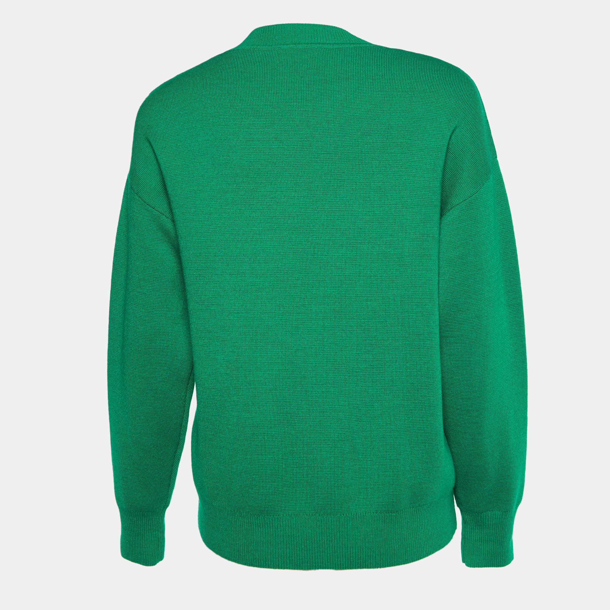 A seamless blend of comfort, luxury, and style, this Sandro green sweater is an example of the label's flawless craftsmanship! Made from a wool blend, the creation has long sleeves and pretty embellishments.