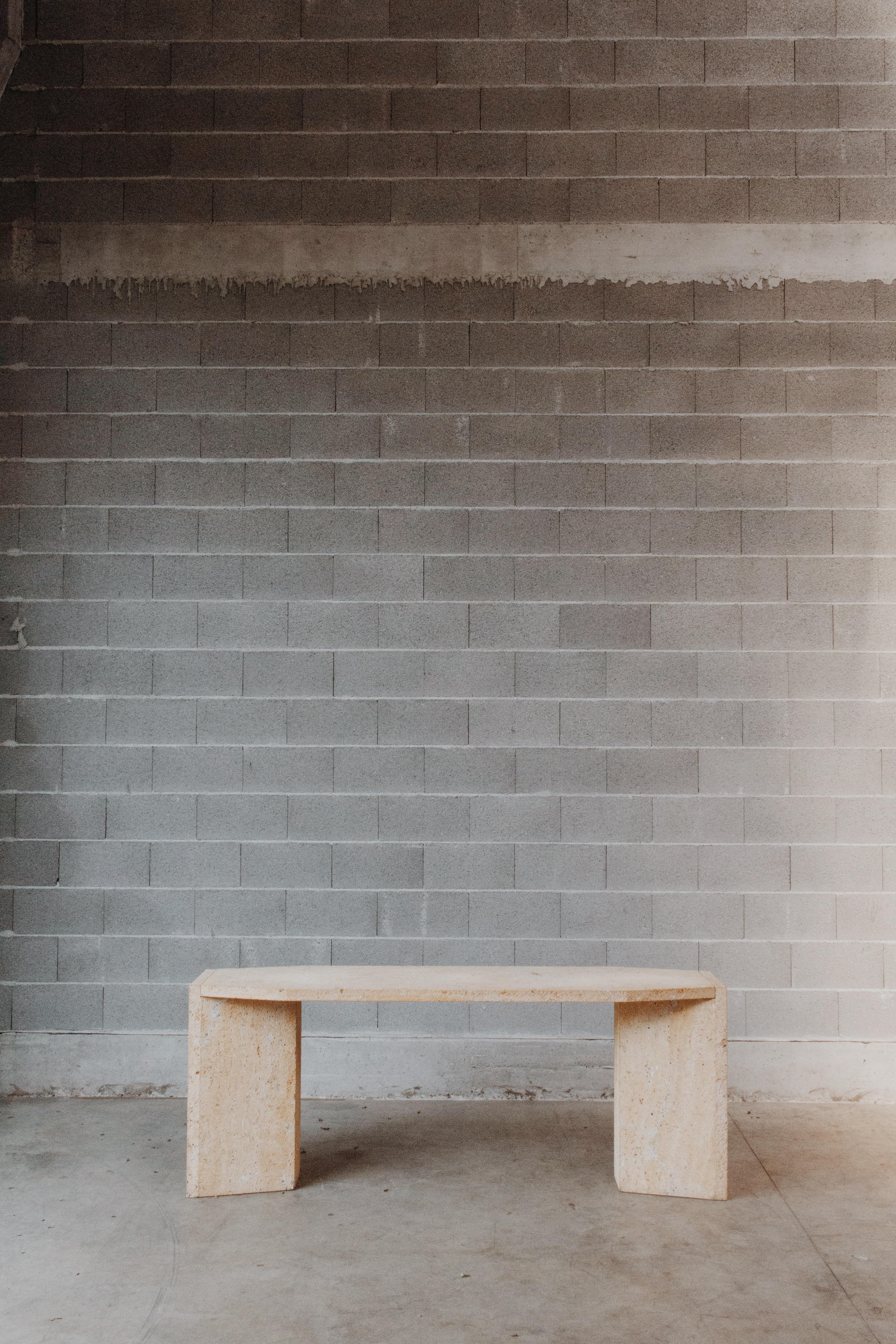 Sandro Petti Console Table in Persian Travertine, 1970s

This particular  table-console reflects the typical Italian design of the 70's. Entirely manufactured in Persian travertine, it comprehends two sculptural side legs supporting the well-shaped