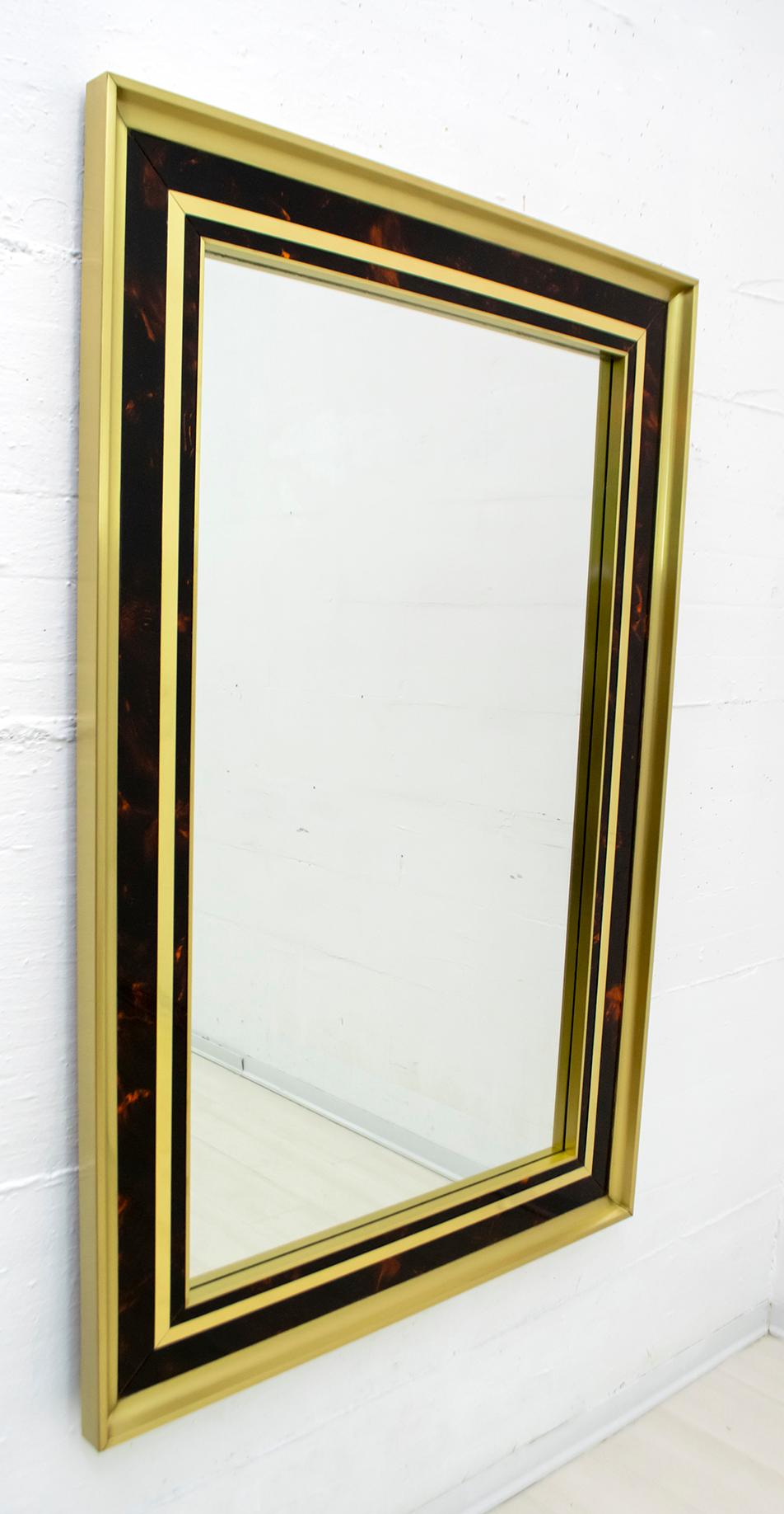 This mirror in polished and satin brass with tortoiseshell effect celluloid inserts, was designed by architect Sandro Petti in the 1970s and produced by Metal Art. In excellent vintage condition, it is a fine example of high quality Italian design