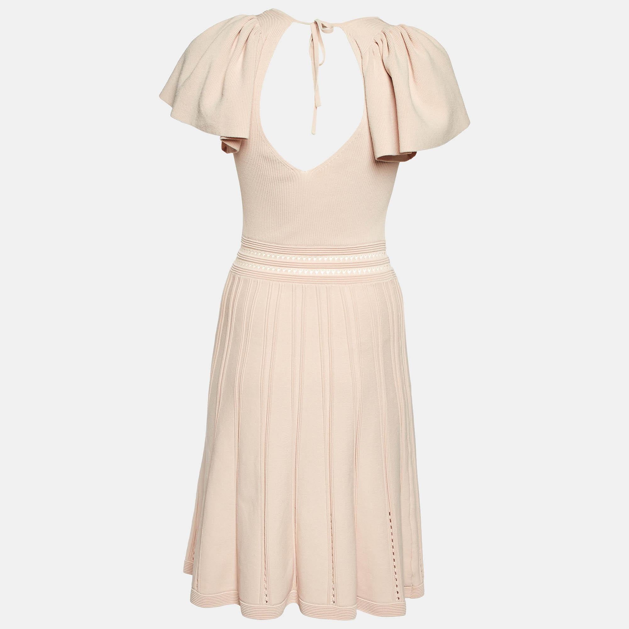 The fine artistry and the feminine silhouette of this designer dress exhibit the labels impeccable craftsmanship in tailoring. It is stitched using quality materials  has a good fit  and can be easily styled with chic accessories  open toe sandals 