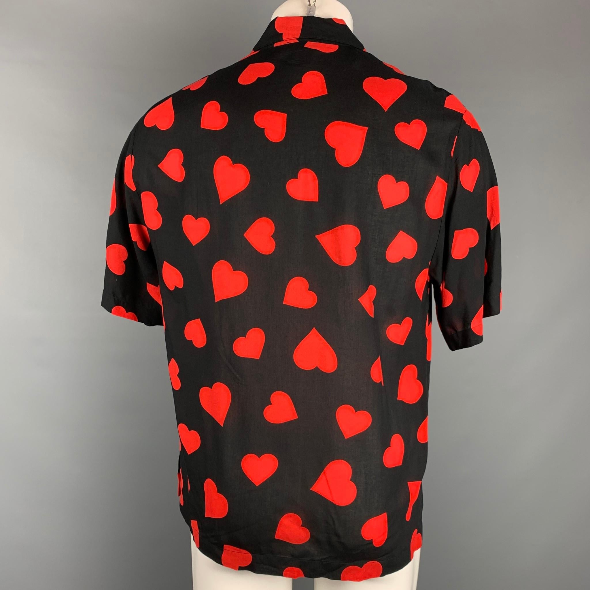 black shirt with red hearts
