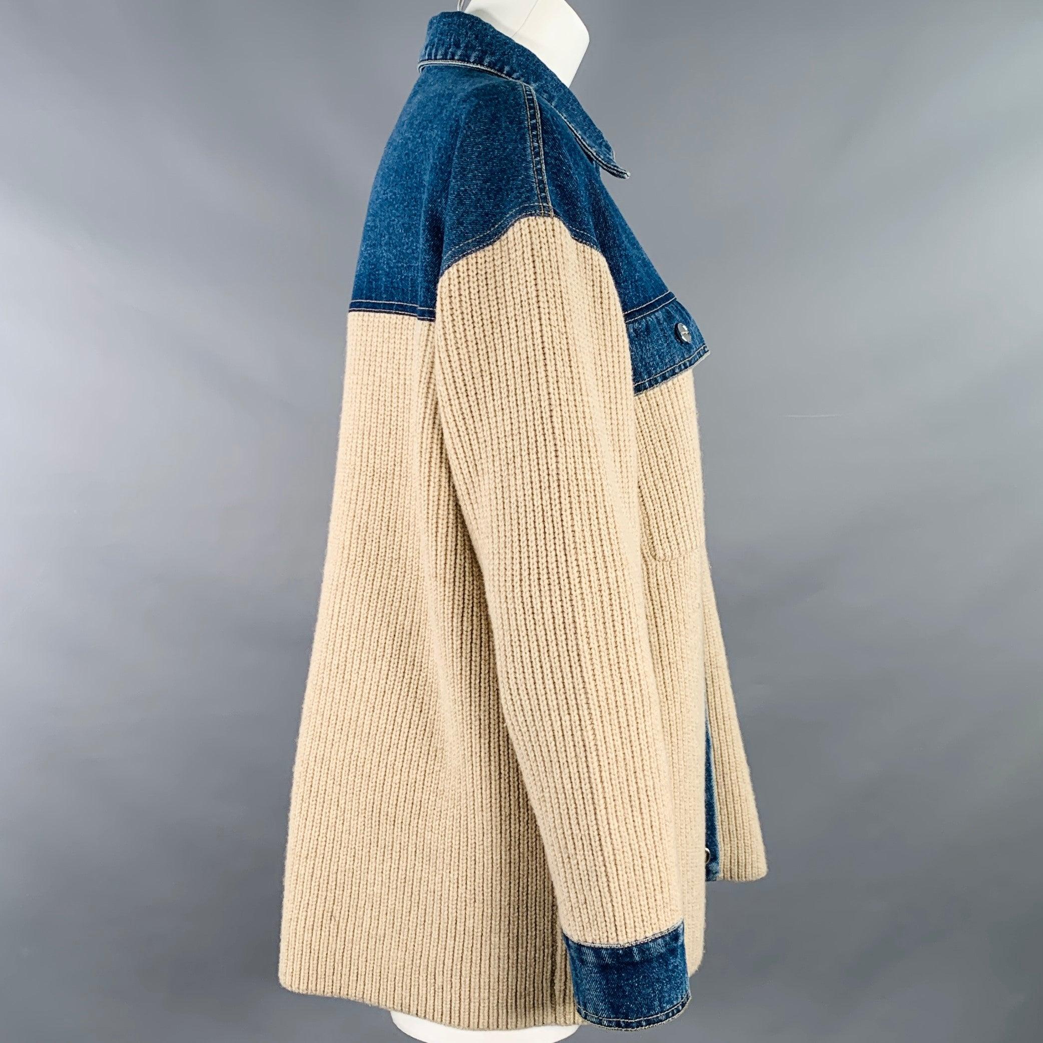 SANDRO jacket in a blue cotton denim with beige knit fabric featuring a rib knit pattern, two flap pockets, and button closure.Very Good Pre-Owned Condition. Minor pilling. 

Marked:   size not marked 

Measurements: 
 
Shoulder: 21 inches Bust: 48