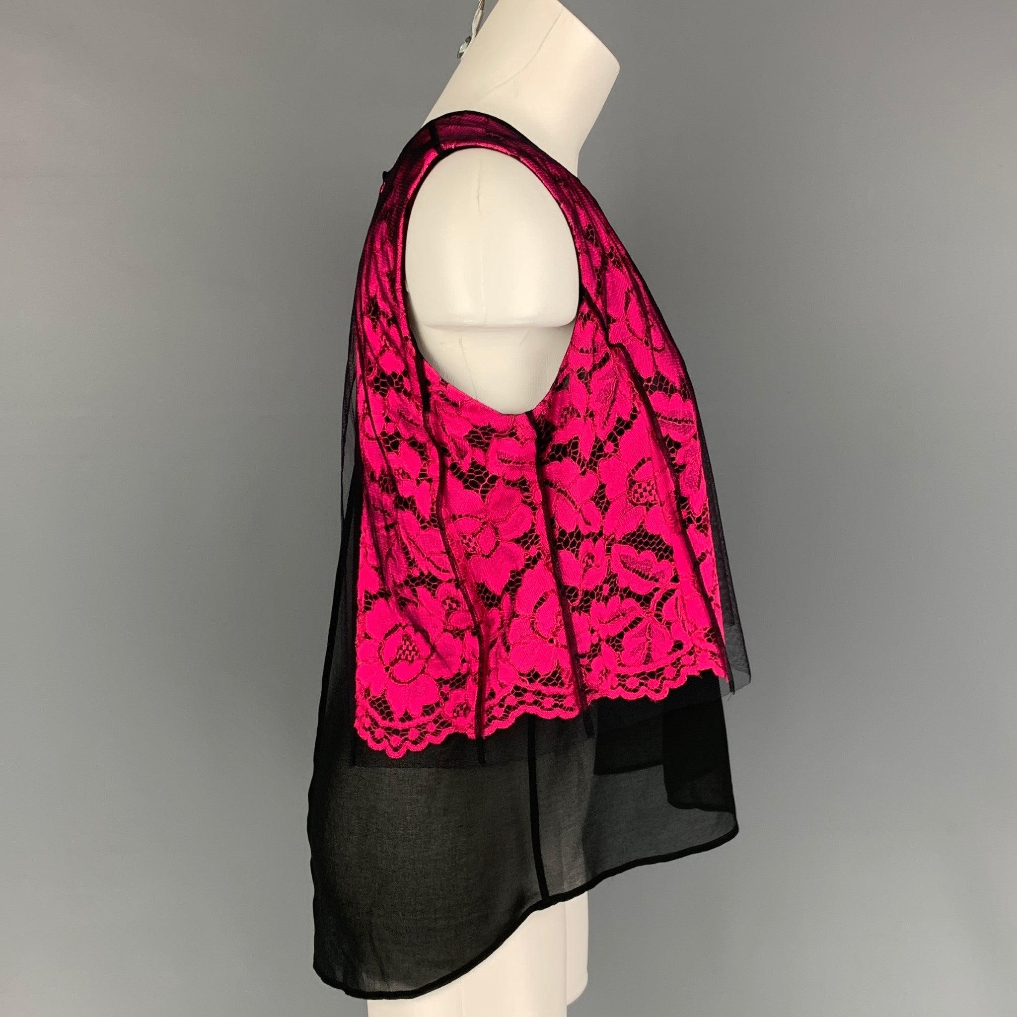 SANDRO dress top comes in a black & pink polyamide featuring a lace panel, sleeveless, and a snap button closure. Made in Bulgaria.
Very Good
Pre-Owned Condition. 

Marked:   2 

Measurements: 
 
Shoulder:
13.5 inches  Bust: 36 inches  Length: 25