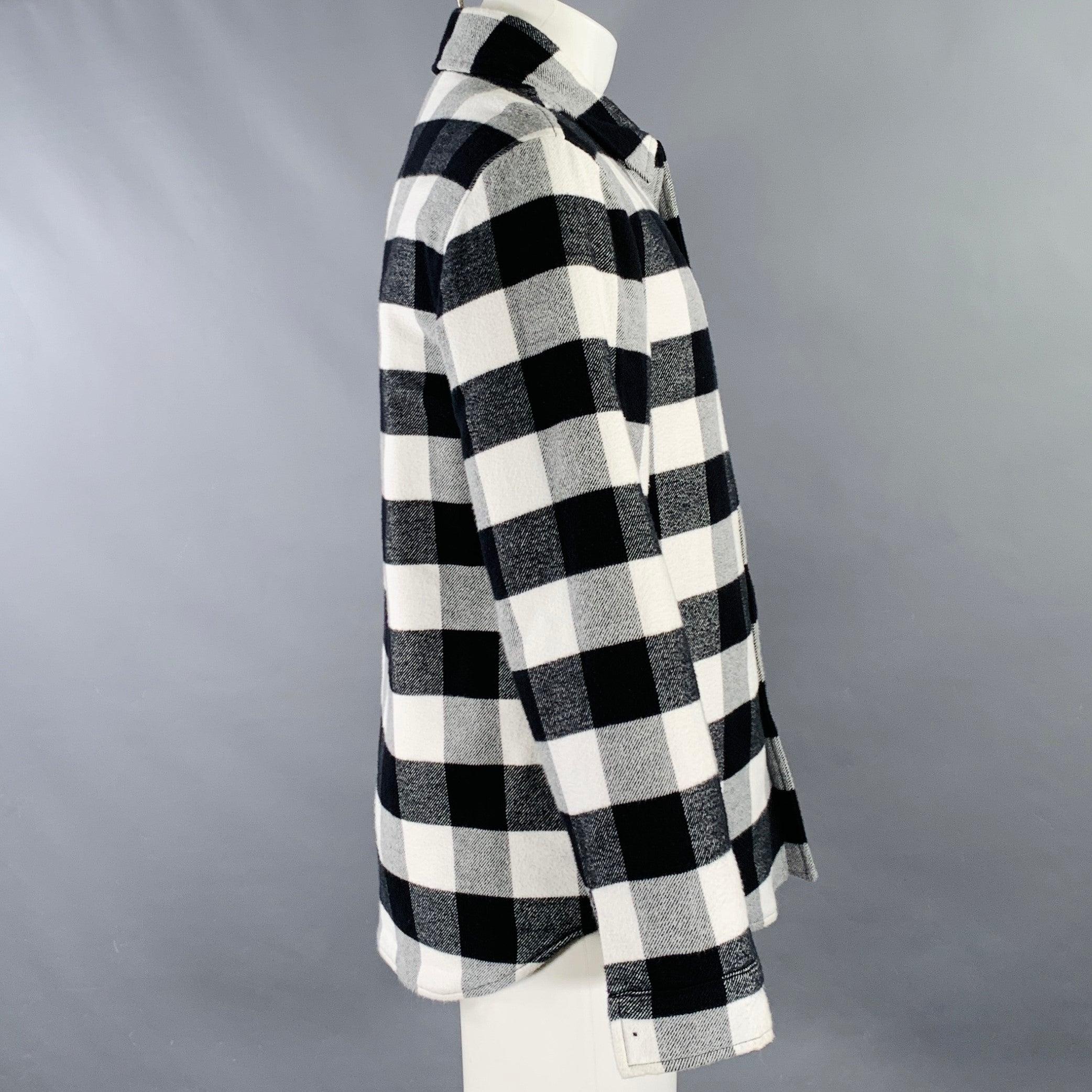 SANDRO shirt jacket
in a black and white cotton featuring a buffalo plaid pattern, two slip pockets, and snap closure. Made in Romania.Very Good Pre-Owned Condition. Missing snap on right cuff, as is. Very minor mark. 

Marked:   M 

Measurements: 
