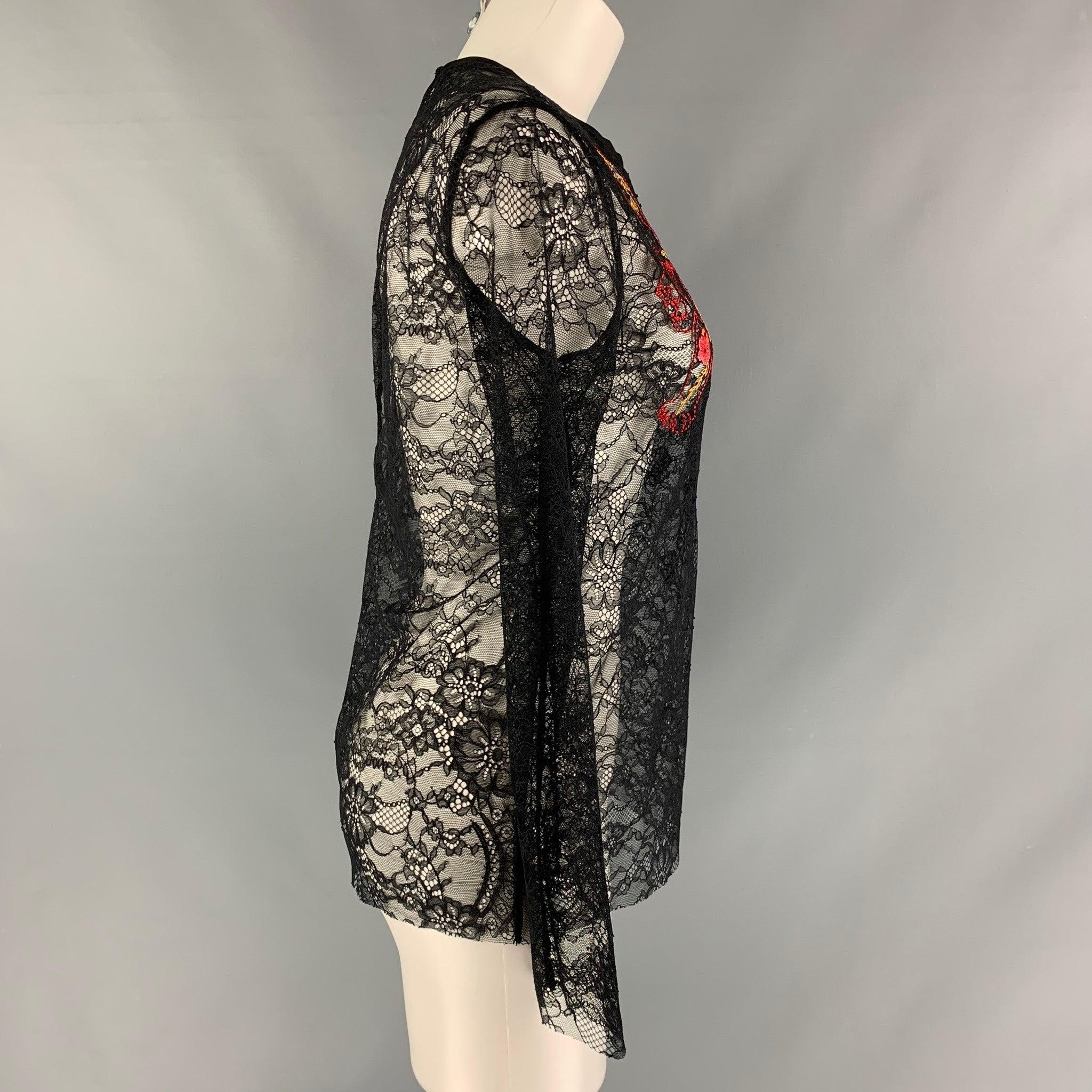 SANDRO PARIS long sleeve dress top comes in a black lace polyamide featuring a front tiger embroidery design, crew-neck, and a single button closure at center back. Excellent Pre-Owned Condition. 

Marked:   1 

Measurements: 
 
Shoulder: 14.5