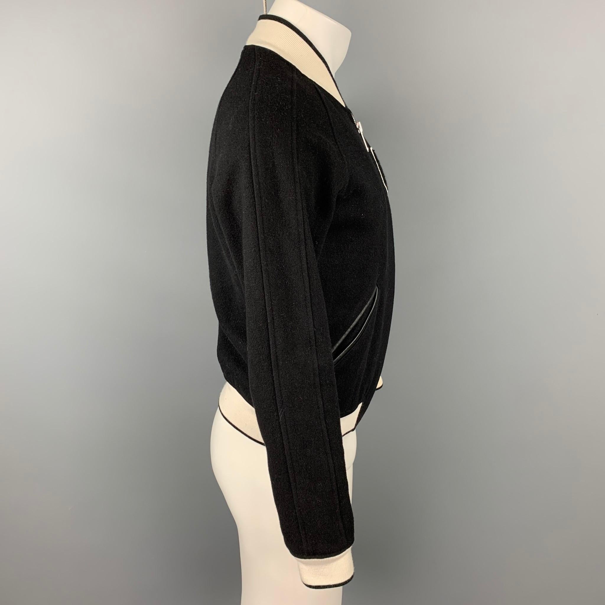 SANDRO jacket comes in a black & white wool with a 
