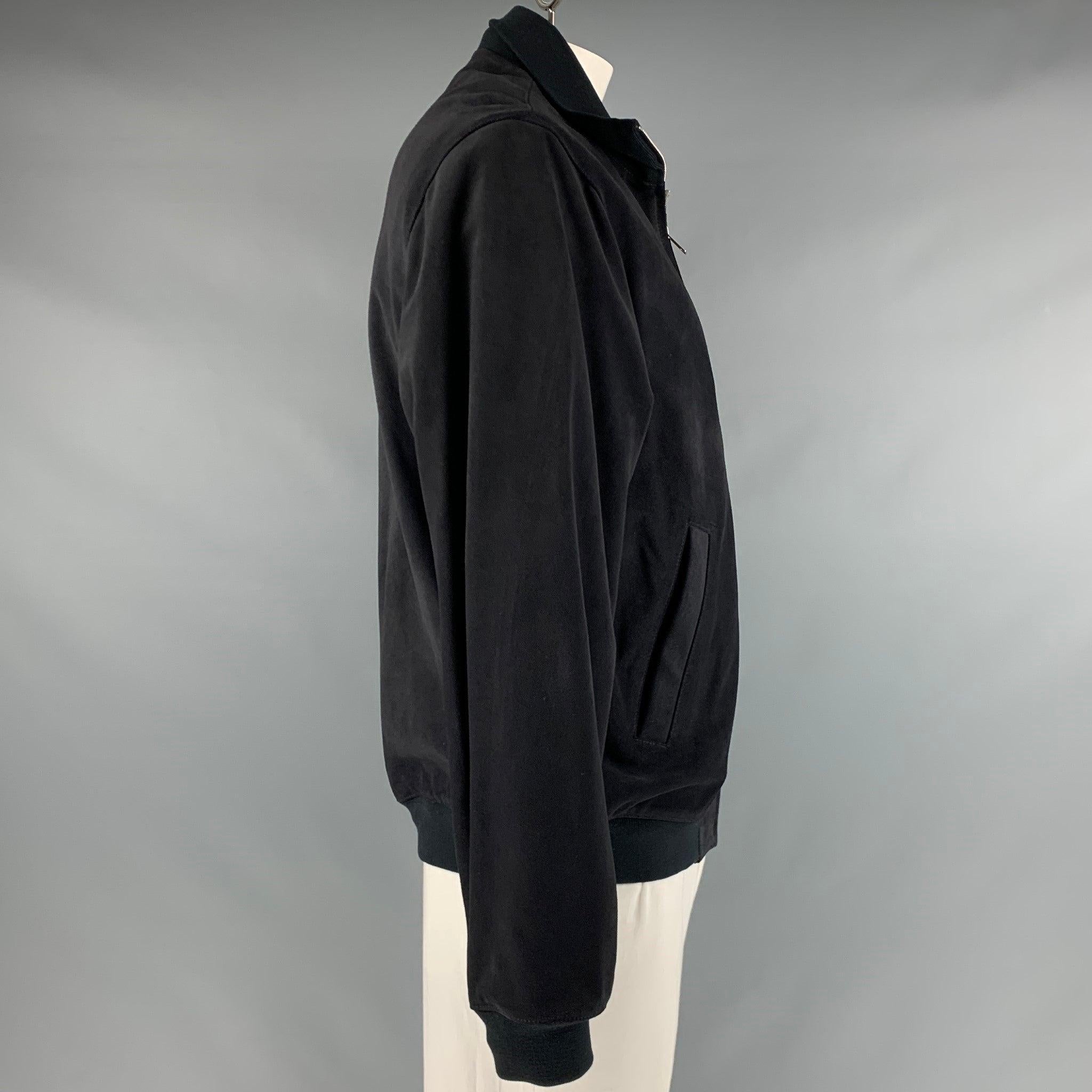 SANDRO
jacket in a black suede fabric featuring a bomber style, two slit pockets, a ribbed collar, and a zip up closure. Excellent Pre-Owned Condition. 

Marked:   XXL 

Measurements: 
 
Shoulder: 18.5 inches Chest: 48 inches Sleeve: 27 inches