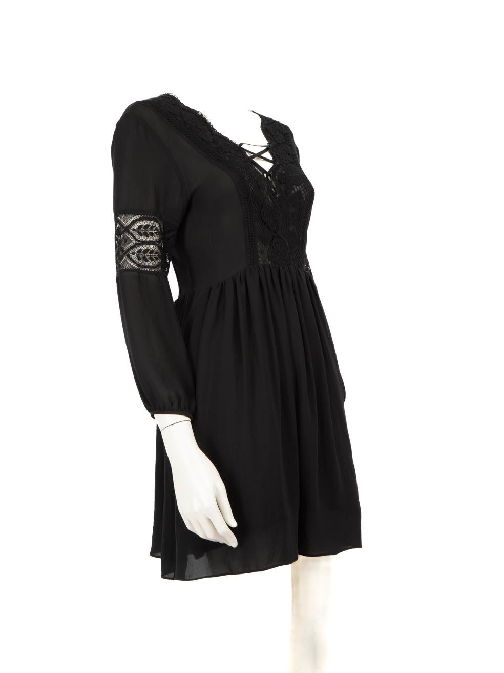 CONDITION is Very good. Minimal wear to the dress is evident. Plucks to the weave on the front and back of this used Sandro designer resale item.
 
 
 
 Details
 
 
 Black
 
 Polyester
 
 Dress
 
 Mini
 
 Long sleeves
 
 Sheer lace panels
 
 Lace up