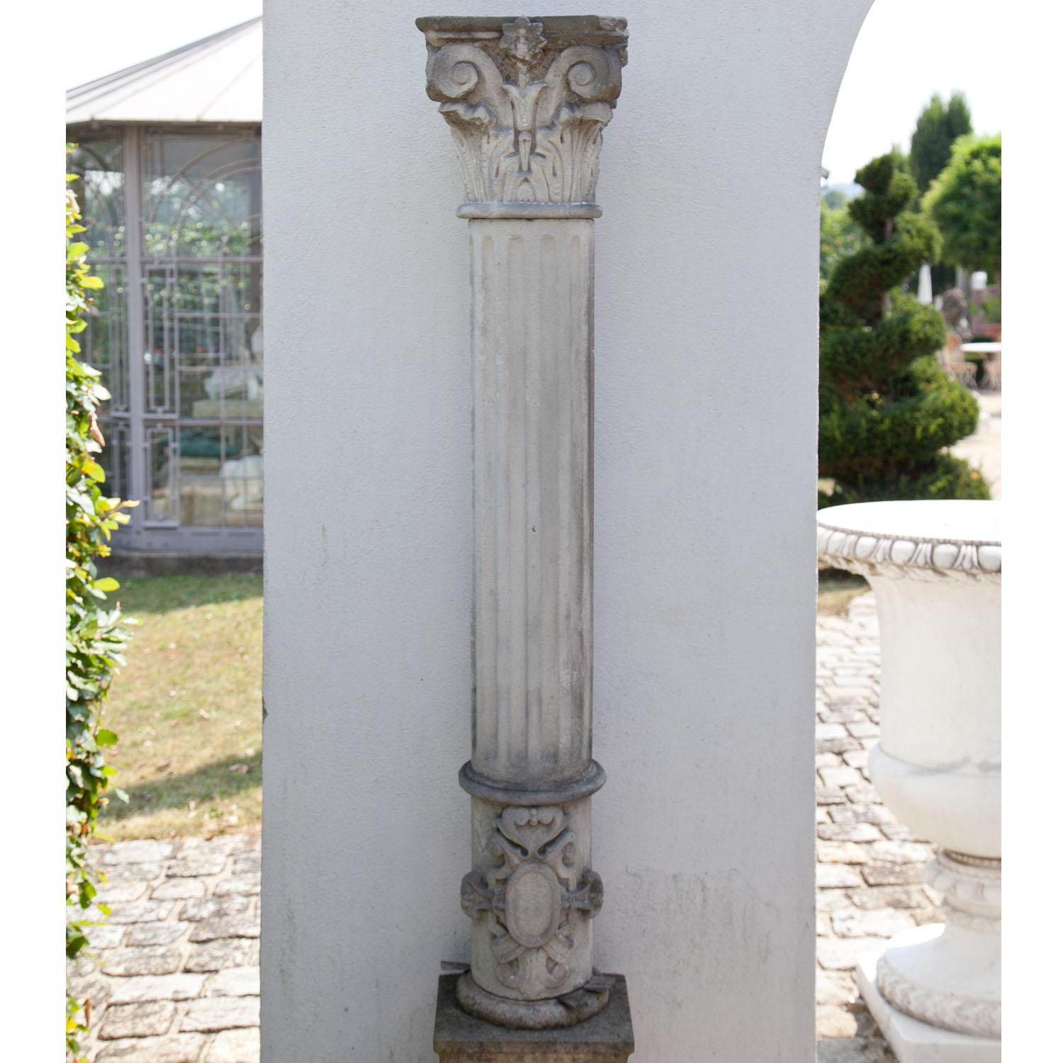 Column out of sandstone with a Corinthian capital and fluted shaft, the base is decorated with scrollwork ornament. Very beautiful natural patina.