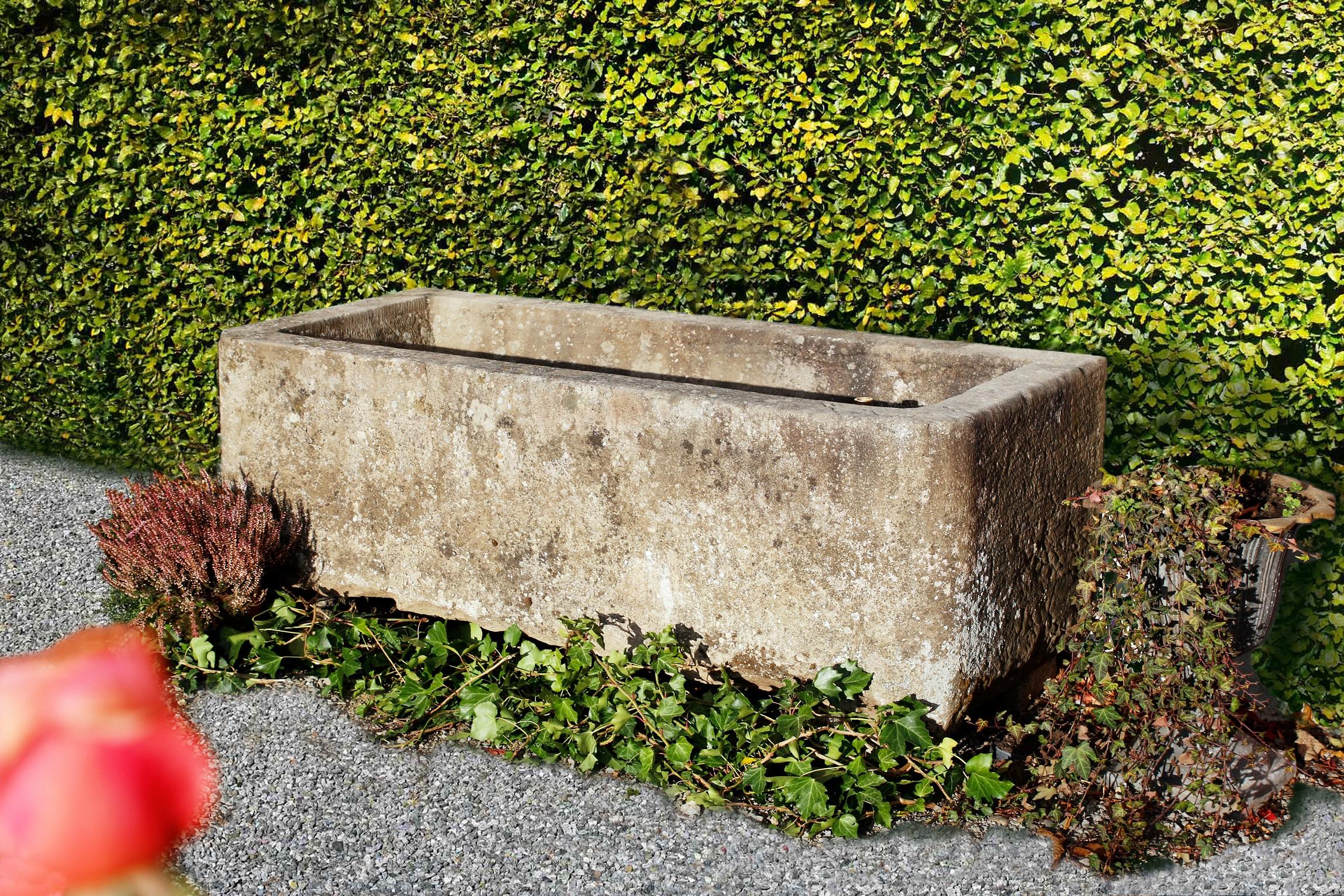 This is a well made sandstone fountain. The fountain is in a very good condition and can also be used as a wall fountain.