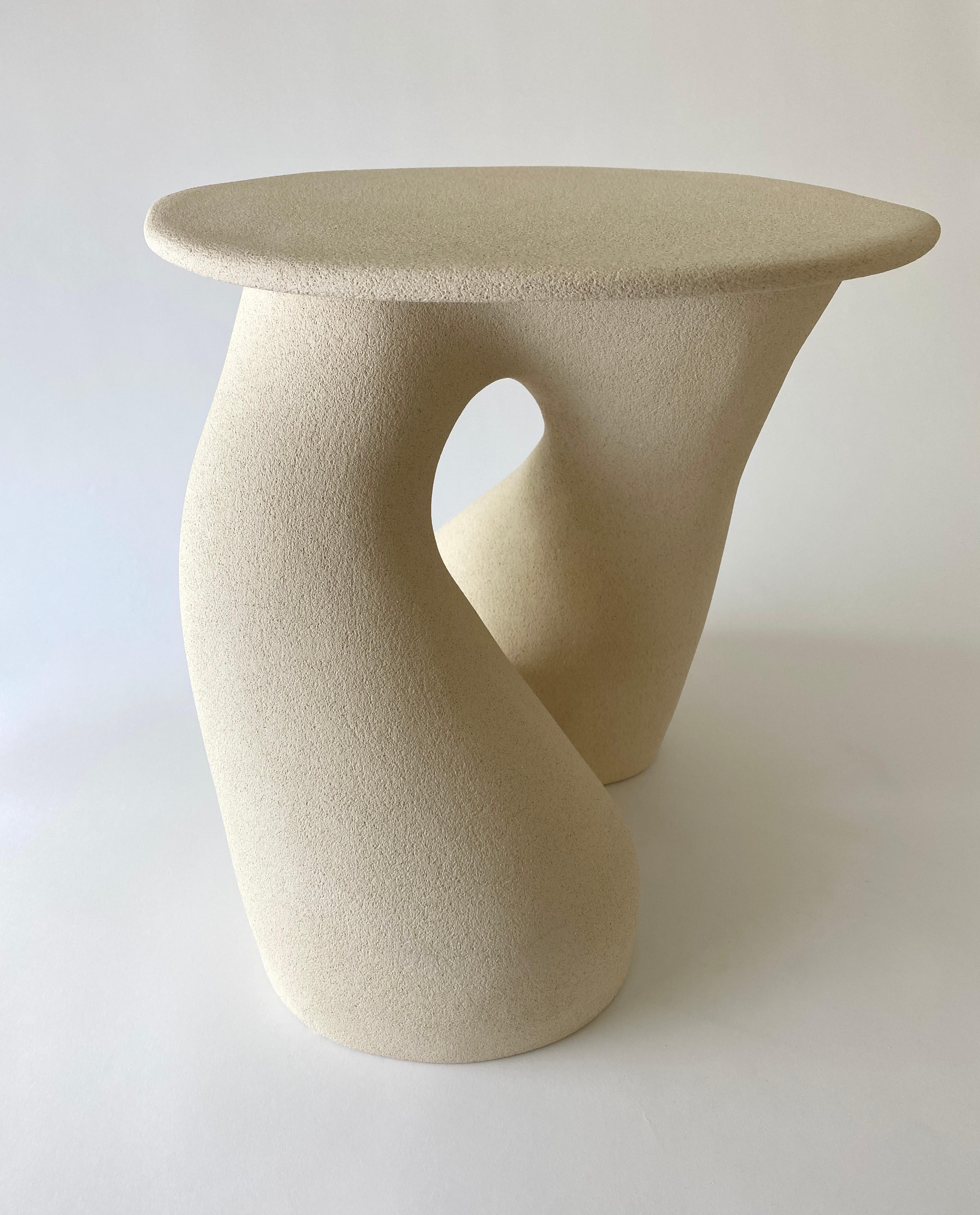 Sandstone Gabrielle side table handsculped by Hermine Bourdin 
Unique
Dimensions: 40 x 40 x 40 cm
Materials: Sandstone

In my work I’m trying to represent women who are free, who are generous, voluptuous, sensual, strong, thriving and protective.
To