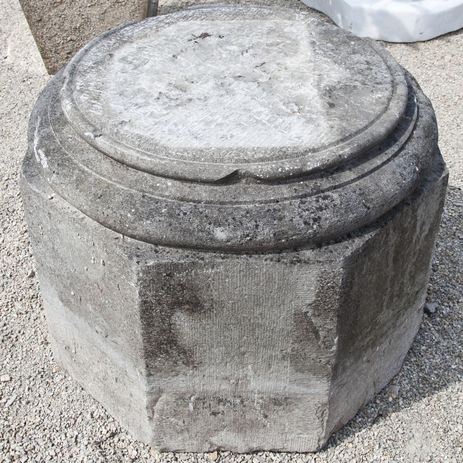 Octagonal pedestal with a profiled round base out of sandstone of the 18th century.