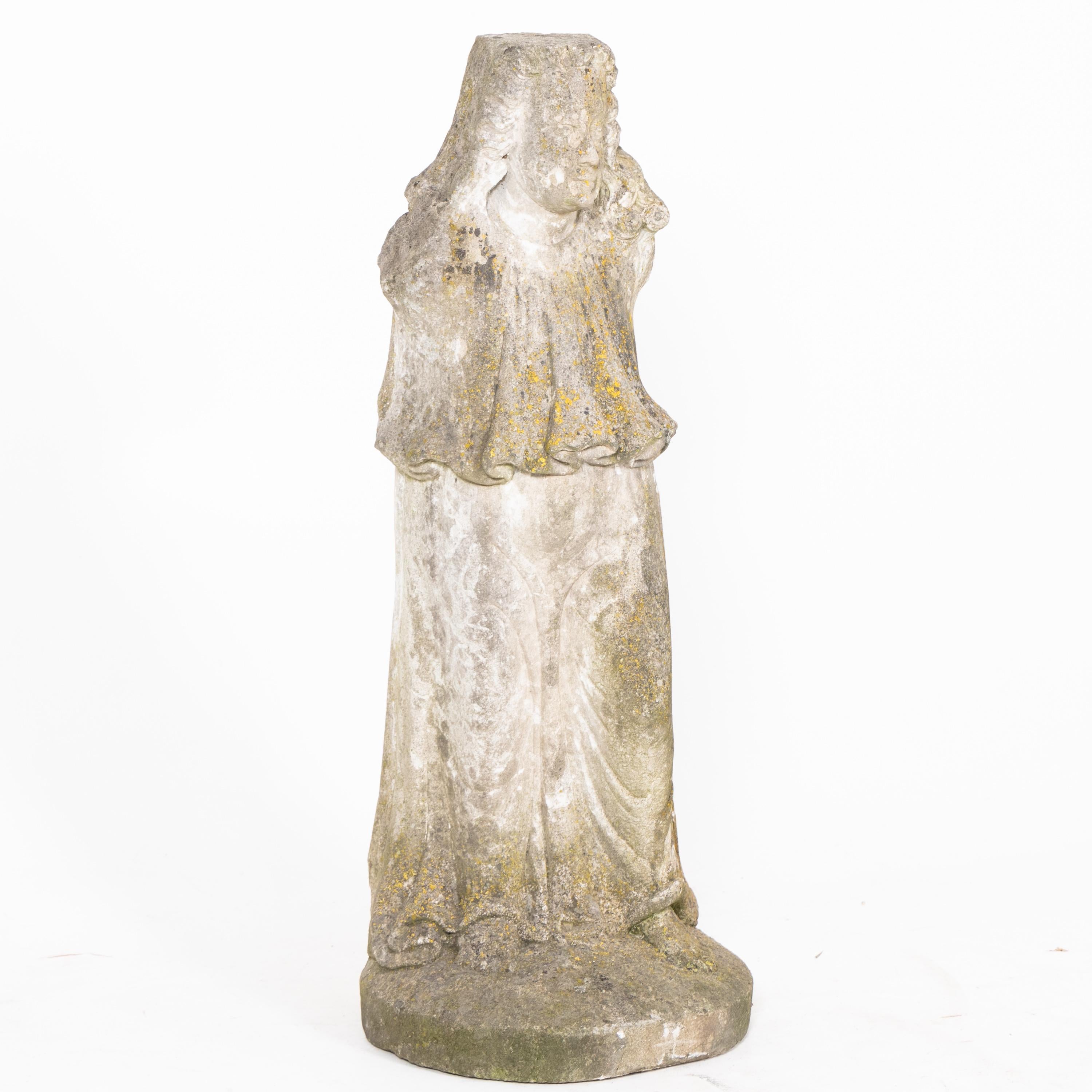 Sandstone sculpture of a saint in a garment rich in folds. Arms and attributes missing. Weathered patina condition.

  