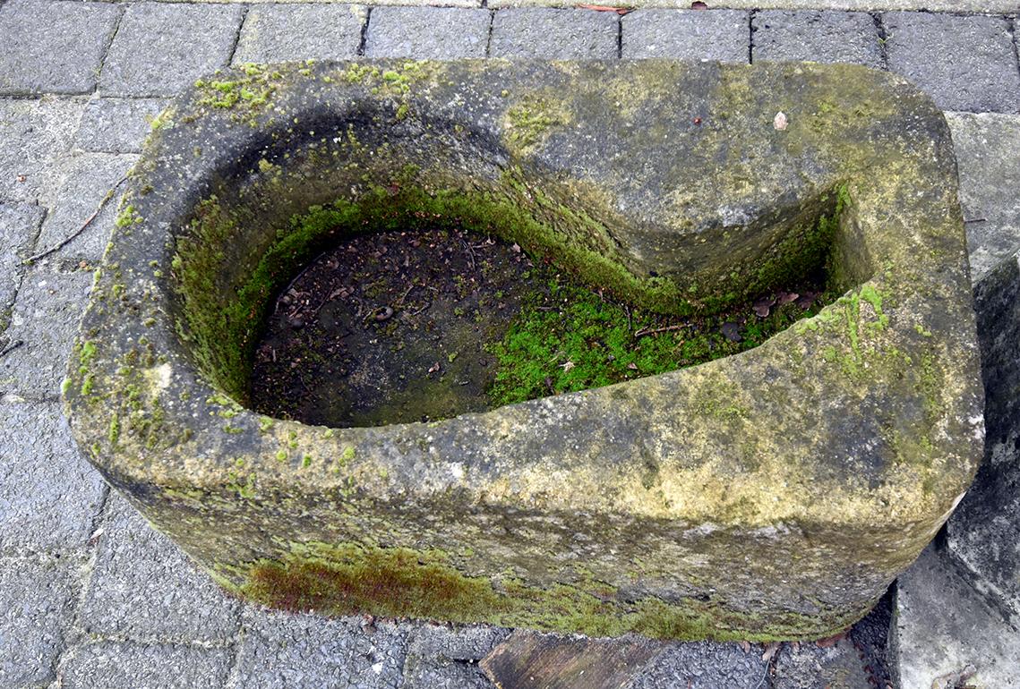 An unique sandstone trough, in a ham shape. 
In the past used to salt the meat.