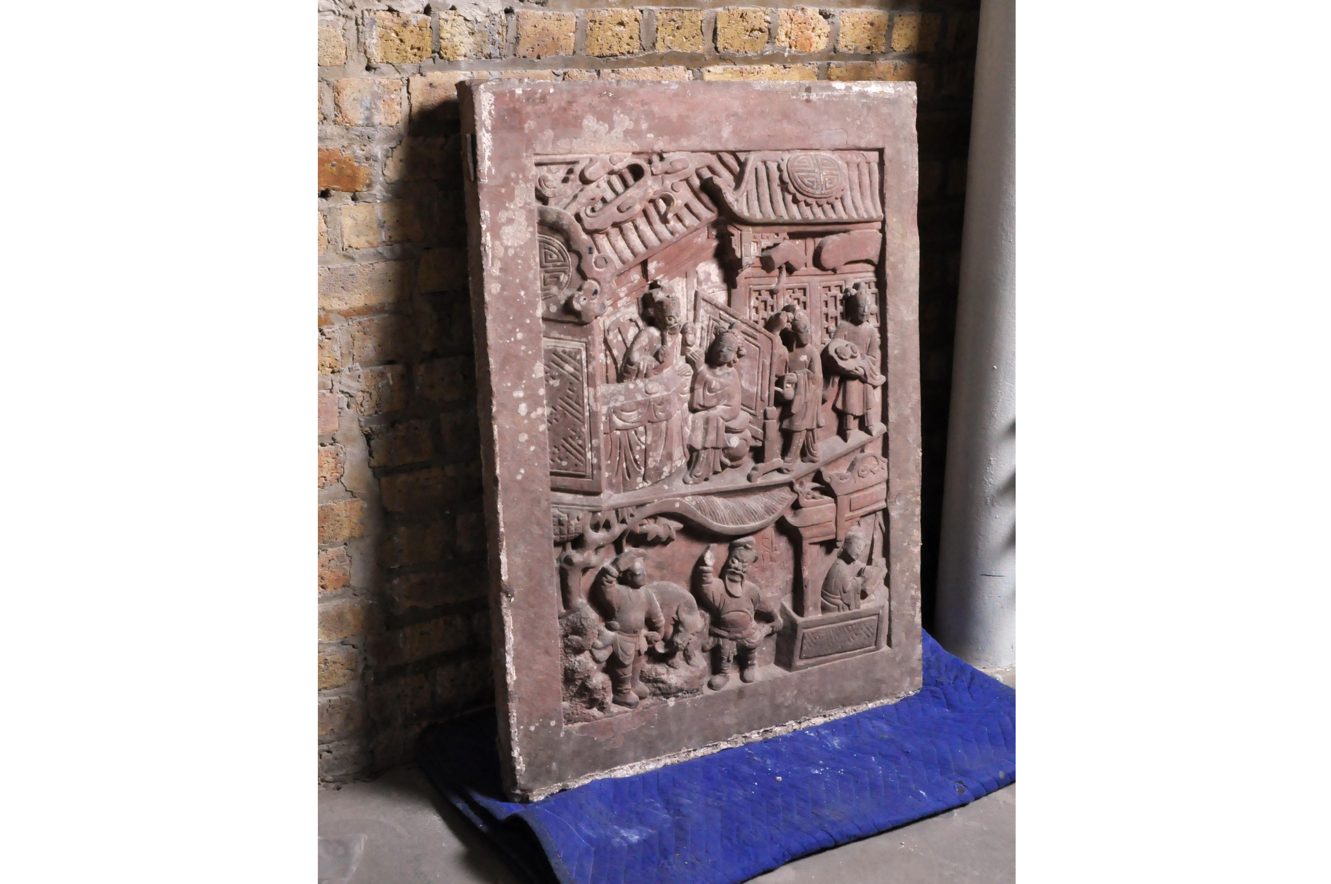 This red sandstone carving was once embedded in the wall surrounding an aristocratic compound. It depicts scholars in a garden, eating and conversing. It came from Shanxi Province and dates to the 18th Century. Such carvings are quite rare now as