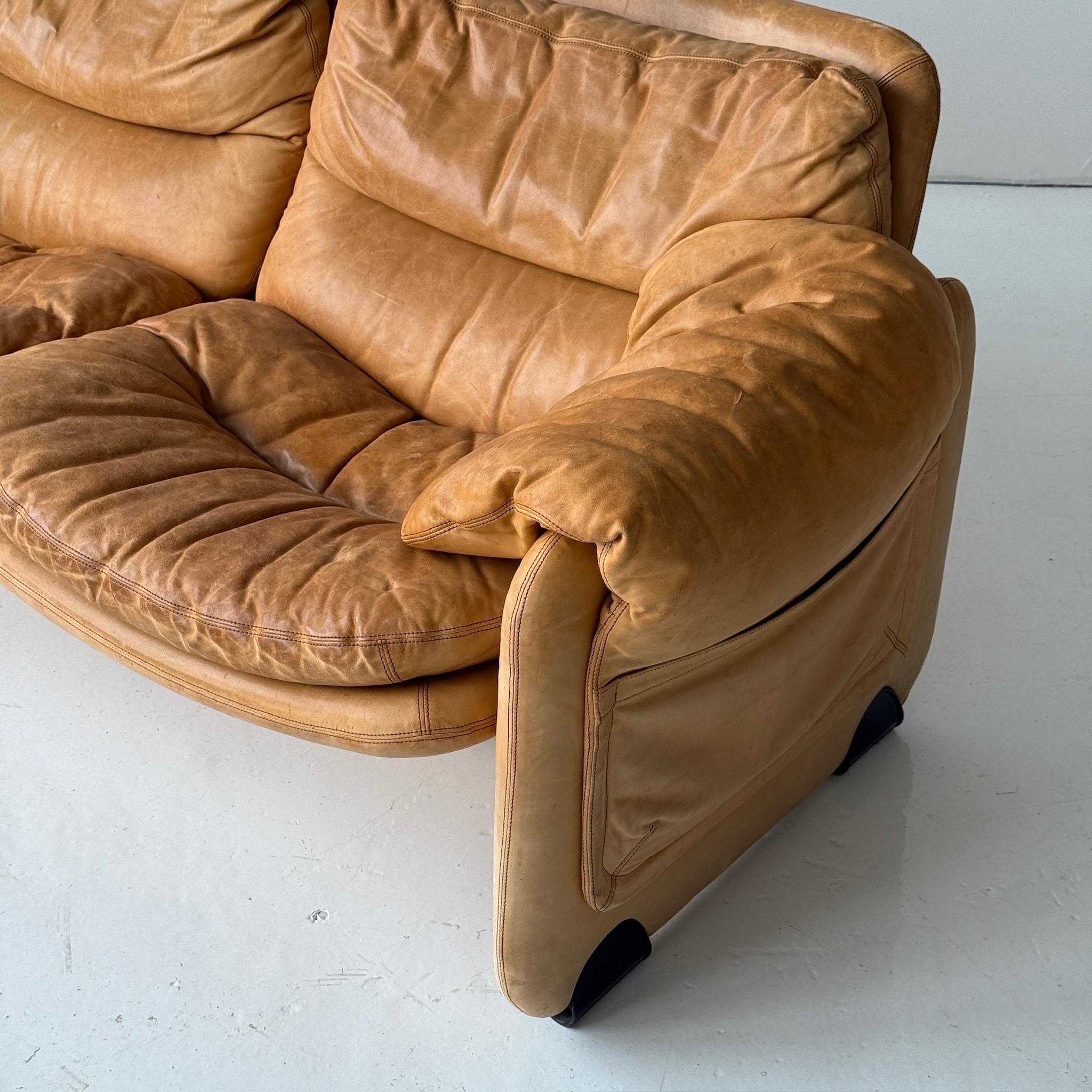 c. 1970s. Italy. Full leather construction with removable armrests. Side pockets on legs.

