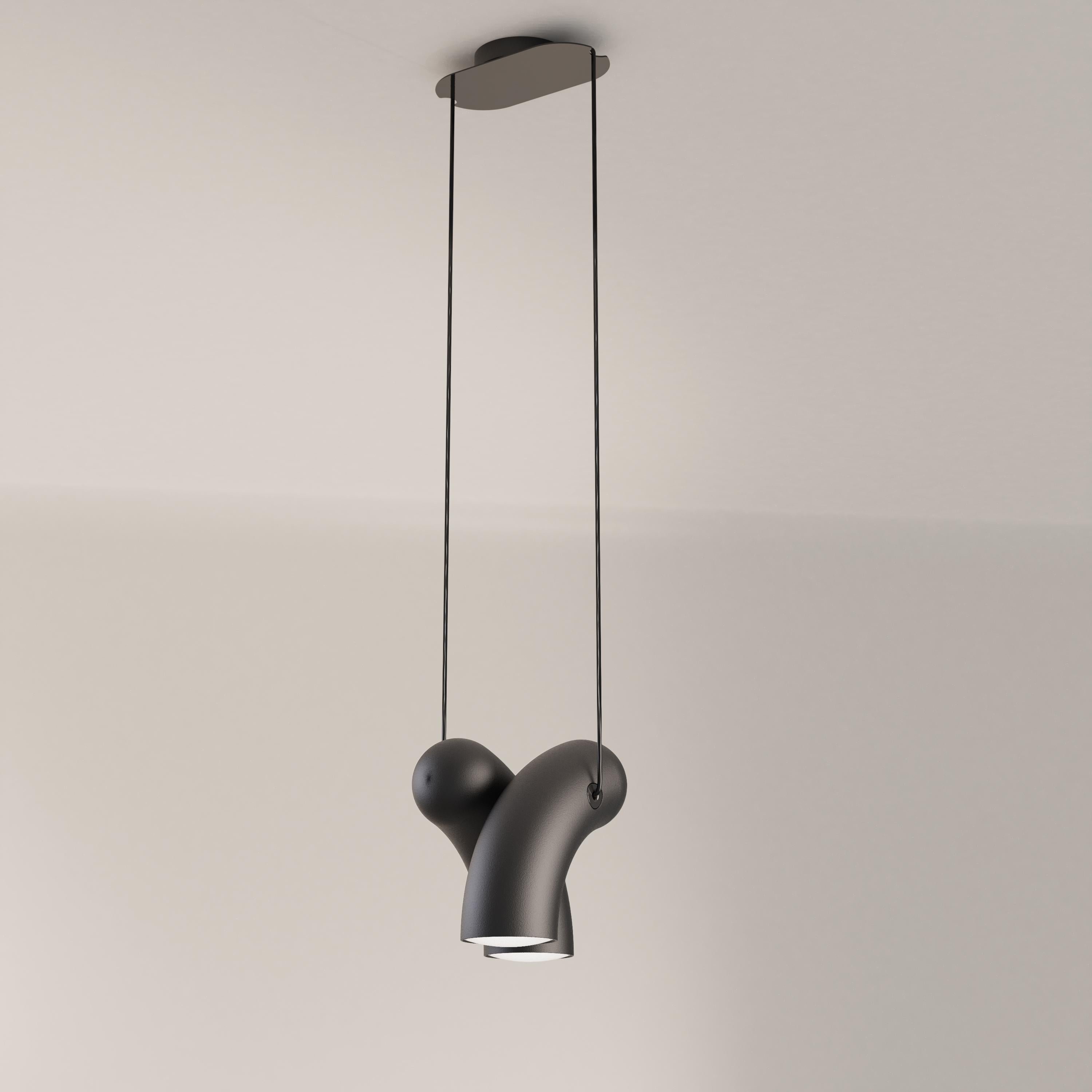 Sandy Black Hyphen pendant lamp by Studio d'Armes
Dimensions: D 29 x W 22 x H 24 cm
Materials: Sanded black cast steel.
Available in steel sandy black, steel chromatic black, natural porcelain and steel custom.

Derived from the ancient Greek
