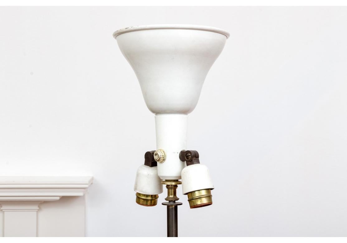 Sang-de-boeuf baluster form vase having a crackle glaze and mounted as a lamp on a brass base with egg and dart motif. 
The lamp with a hardback fabric shade, central bulb flanked by 2 adjacent side lights and metal cap.

Dimensions: 8 1/2