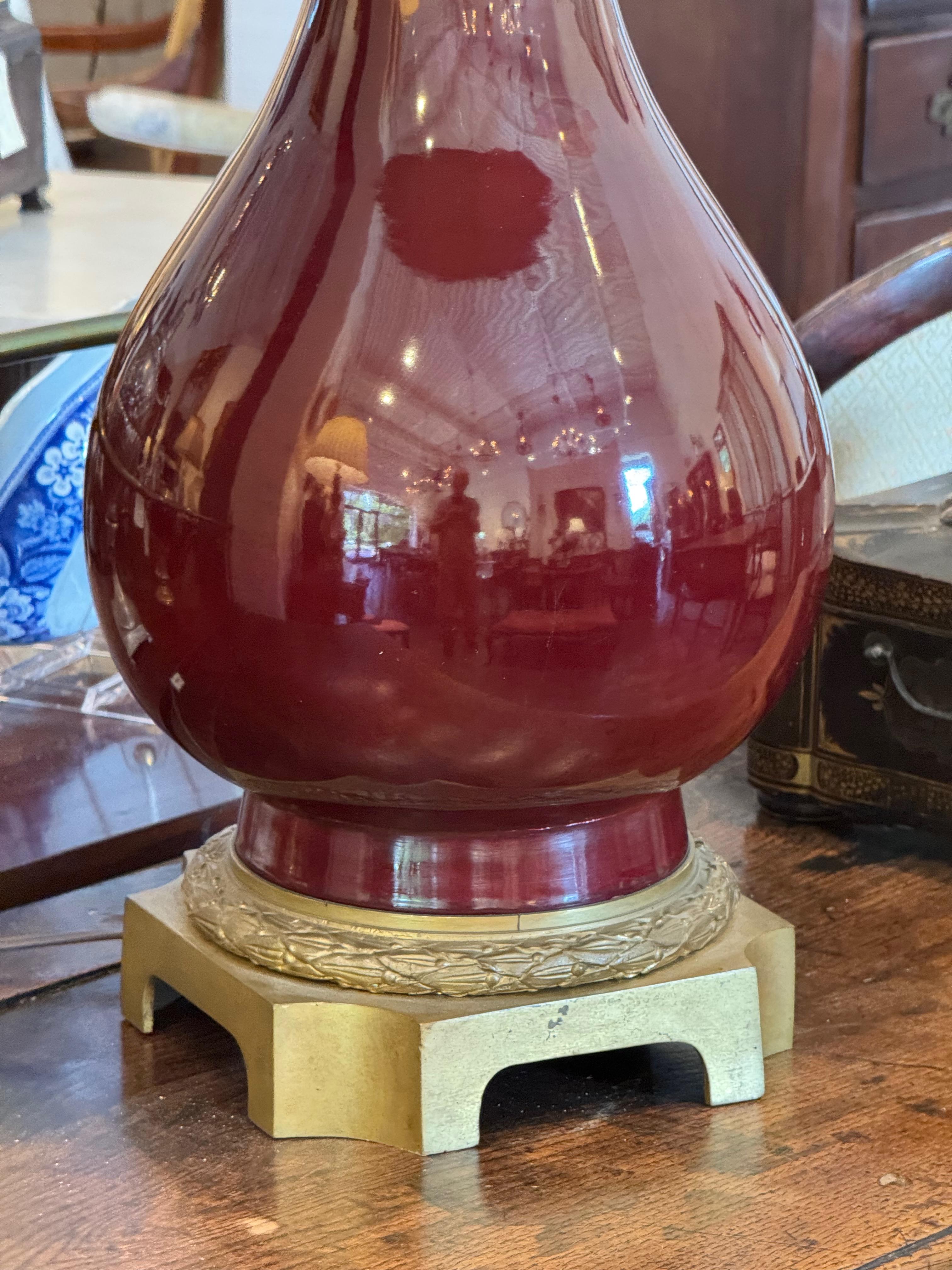 Early 20th Century Sang De Boeuf Glazed Lamp on Brass Base For Sale