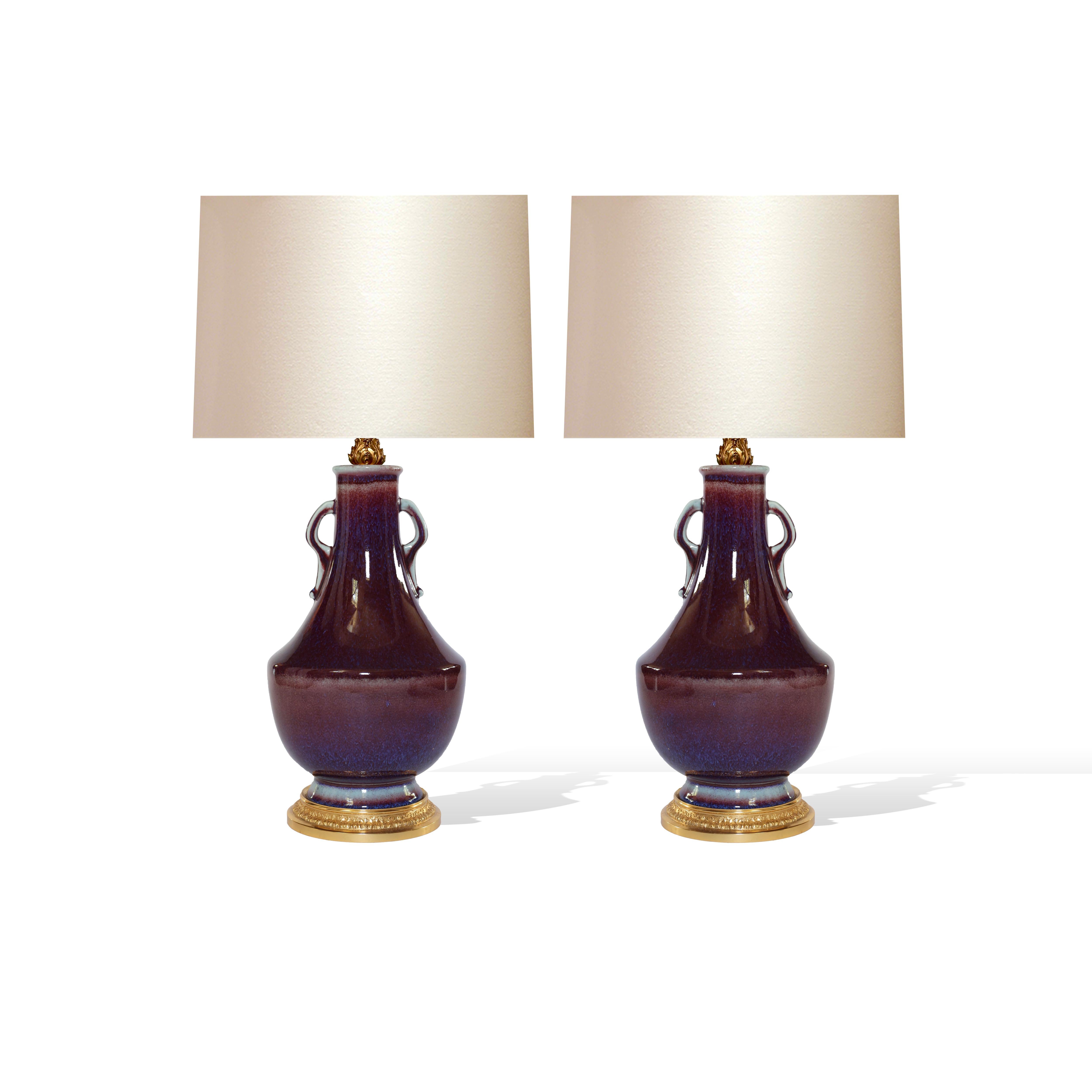 Pair of sang de Bouef porcelain lamps with gilt brass bases.
Lamp shade are not included.
To the top of the vase 14.5 inch.
Each lamp installed two large sockets,
150 w total.