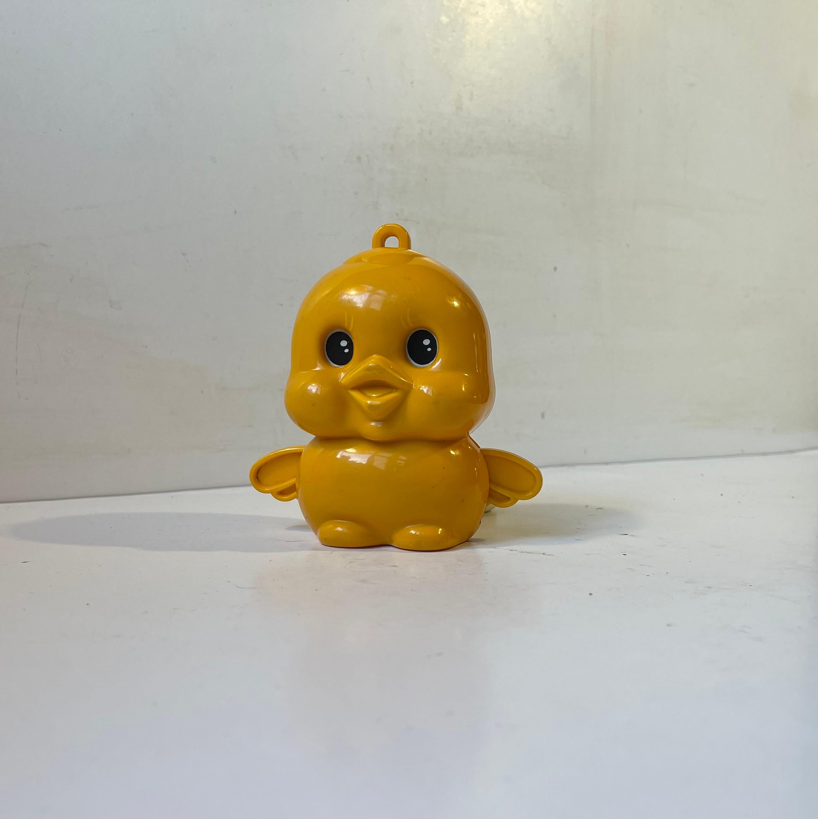 Adorable Chubby Sankyo lullaby duckling in molded yellow plastic. Featuring mechanical music activated by a pull string. Eye and wing movement when playing. Dated 1974, Sankyo Japan. Working order. Measurements: 12x11x7 cm.