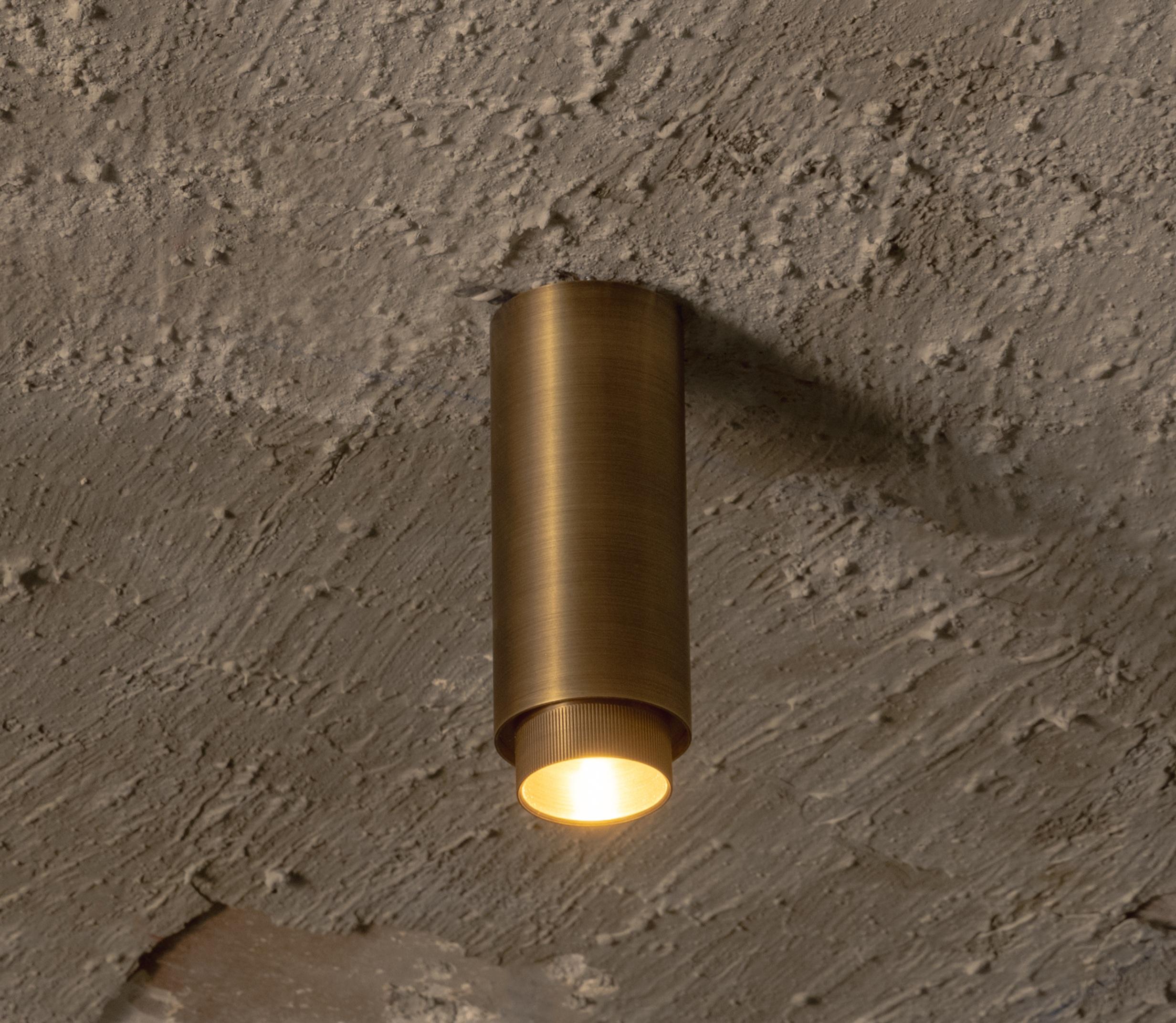 Santa 63 Surface-Mounted Downlight Lamp in Aged Brass by Nuumbra
Dimensions: Ø 6,3 x H 17 cm. 
Materials: Aged brass.

Available in blackened steel or in aged brass. Prices may vary. All our lamps can be wired according to each country. If sold to