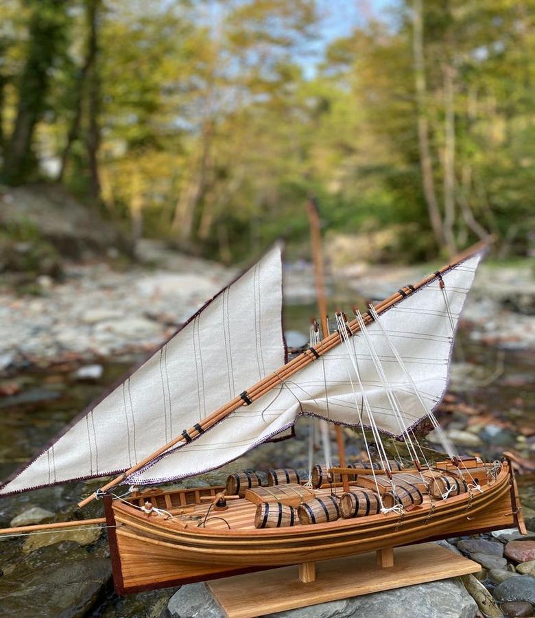 The handmade, historical Santa Lucia model ship is a sailboat made of mahogany and eucalyptus wood. At a length of 28 inches and a height of 20.7 inches, this beautiful ship has been meticulously crafted down to the finest detail. The intricate