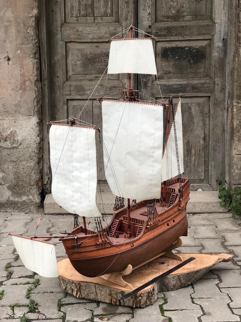 This stunning, handcrafted Santa Maria ship made of natural mahogany and laurel trees will captivate you with its stunning details. Measuring 31.5 inches in length, 31.5 inches in height, and 6 inches in width, this magnificent sailboat stands out