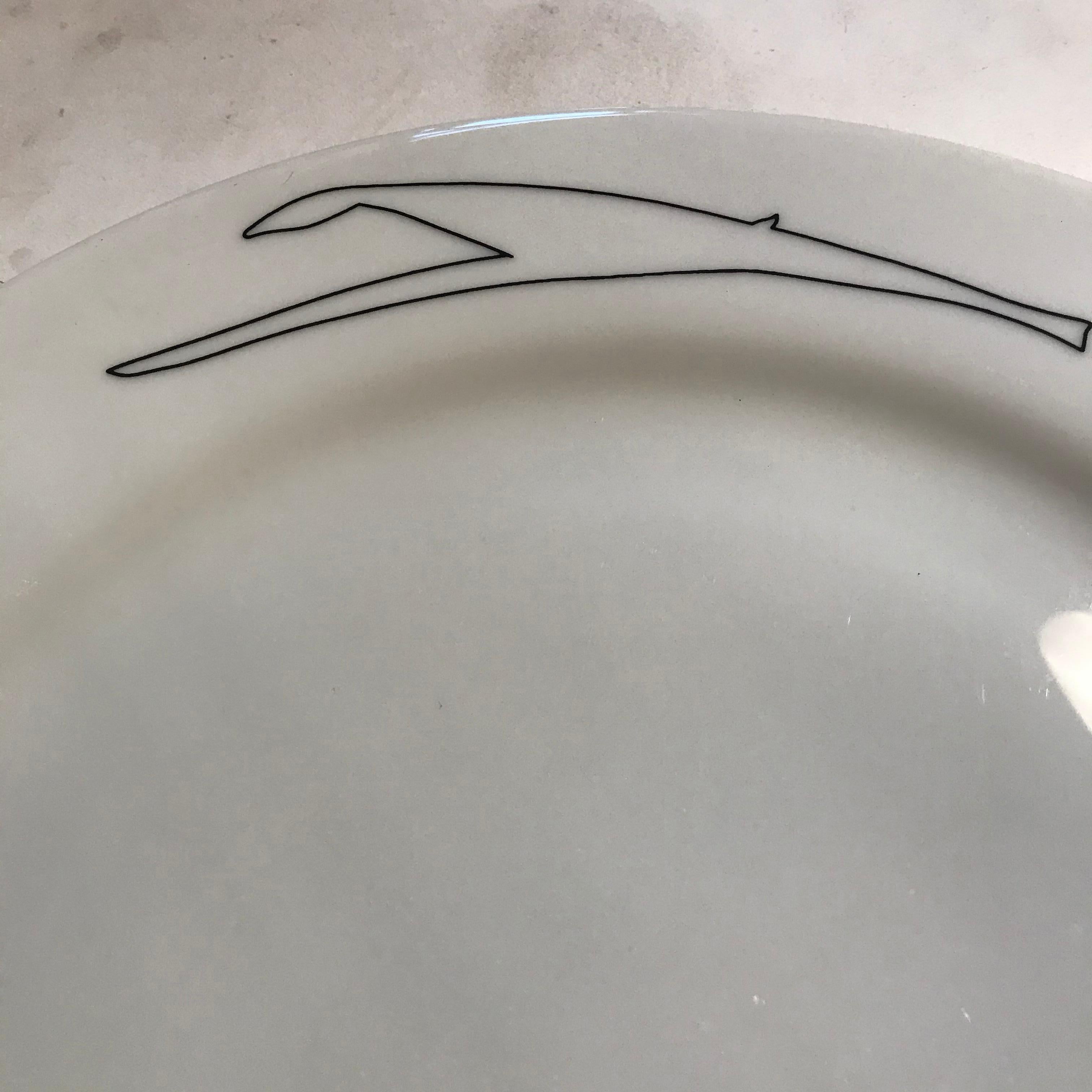 Ceramic plate designed by artist Àlvaro Siza. Produced on the occasion of the Santa Monica Museum of Art’s 20th anniversary. Edition of 125 Plate signed; numbered and stamped with artist signature and SMMOA 20th Anniversary stamp to the verso.
  