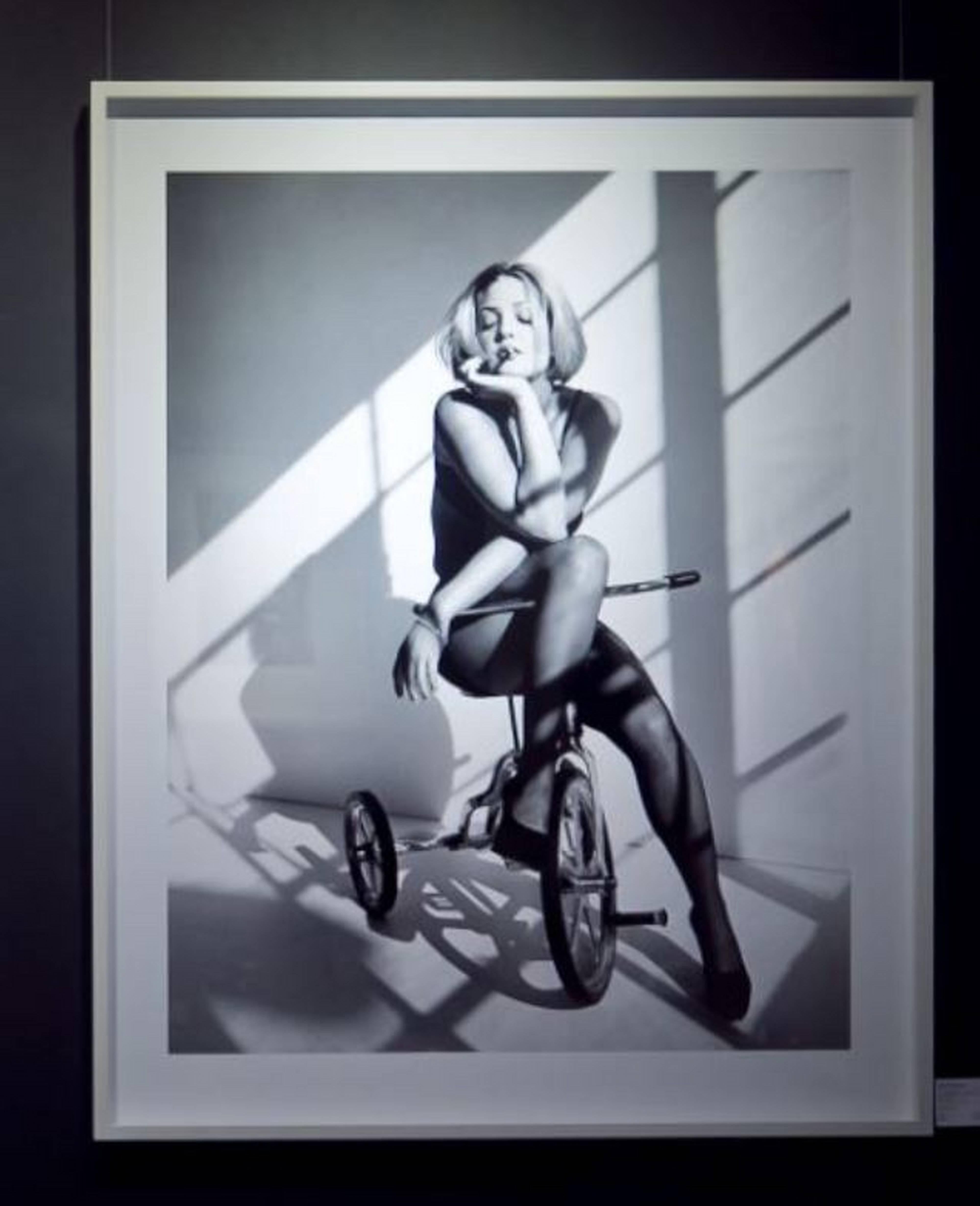 Drew Barrymore - portrait smoking on a tricycle, fine art photography, 1993 - Photograph by Sante D´ Orazio