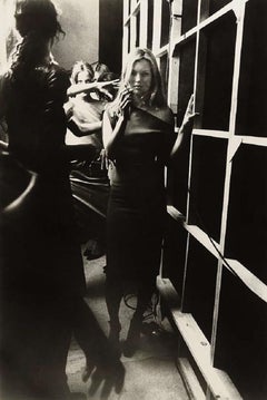 Kate Moss Backstage - the supermodel smoking in a black dress