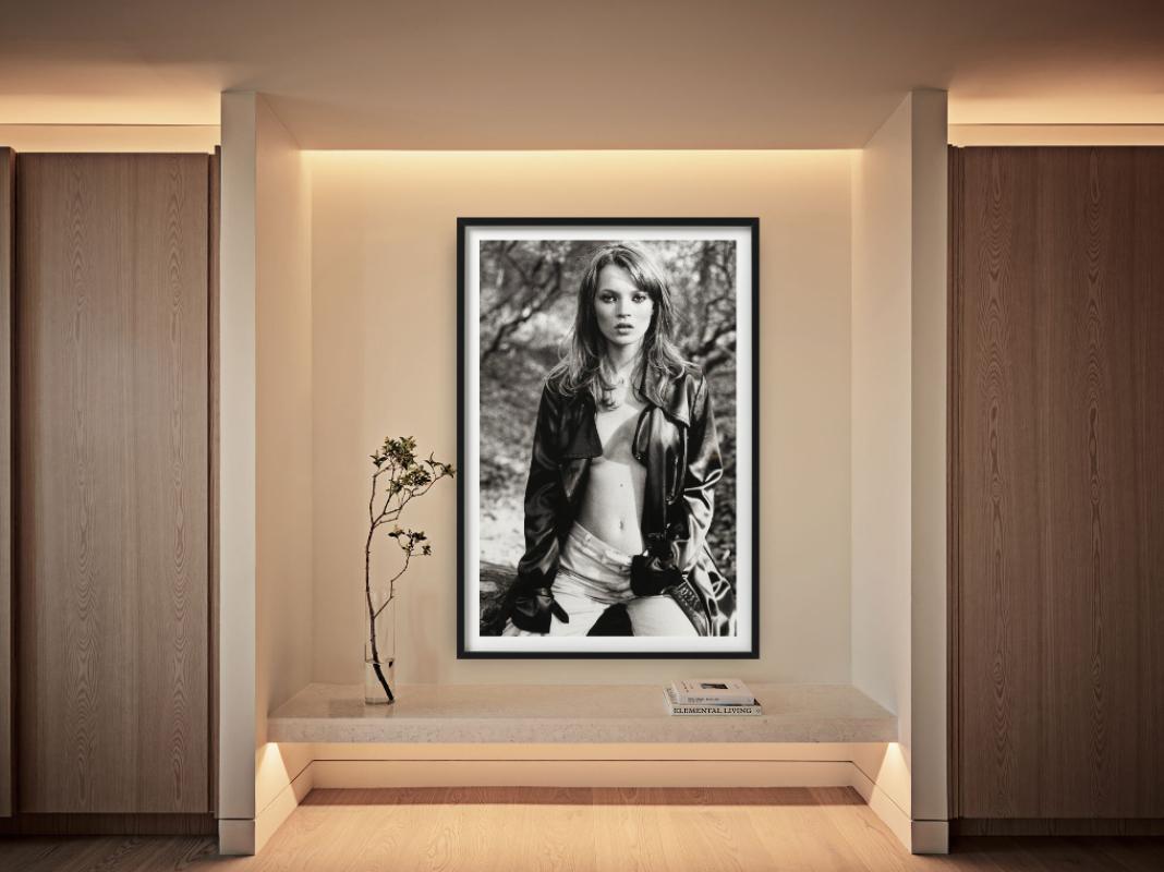 A black-and-white fashion portrait in nature of the famous supermodel Kate Moss in a black leather jacket. Photographed by Sante D'Orazio in Glen Cove in 1995.

All prints are limited edition. Available in multiple sizes. High-end framing on