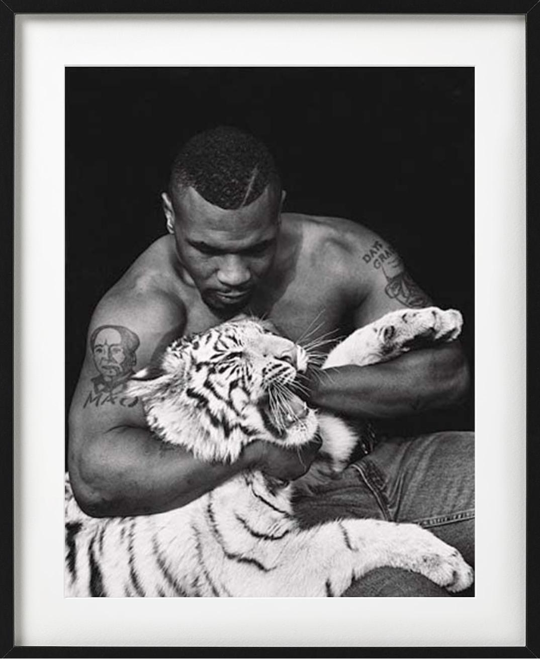 Mike Tyson, Vegas - the Boxer with a white Tiger cub, fine art photography, 1996 - Black Black and White Photograph by Sante D´ Orazio