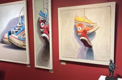 "#1401" oil painting of red, orange and yellow converse sneakers hanging